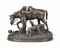 A LARGE FRENCH BRONZE EQUESTRIAN GROUP OF A YOUNG HUNTSMAN AND HOUNDS, ENTITLED 'LE RETOUR DE LA CHASSE A COURRE'