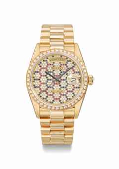 http://www.christies.com/lotfinderimages/d58416/rolex_a_very_rare_and_unusual_18k_gold_diamond_ruby_and_sapphire-set_a_d5841690h.jpg