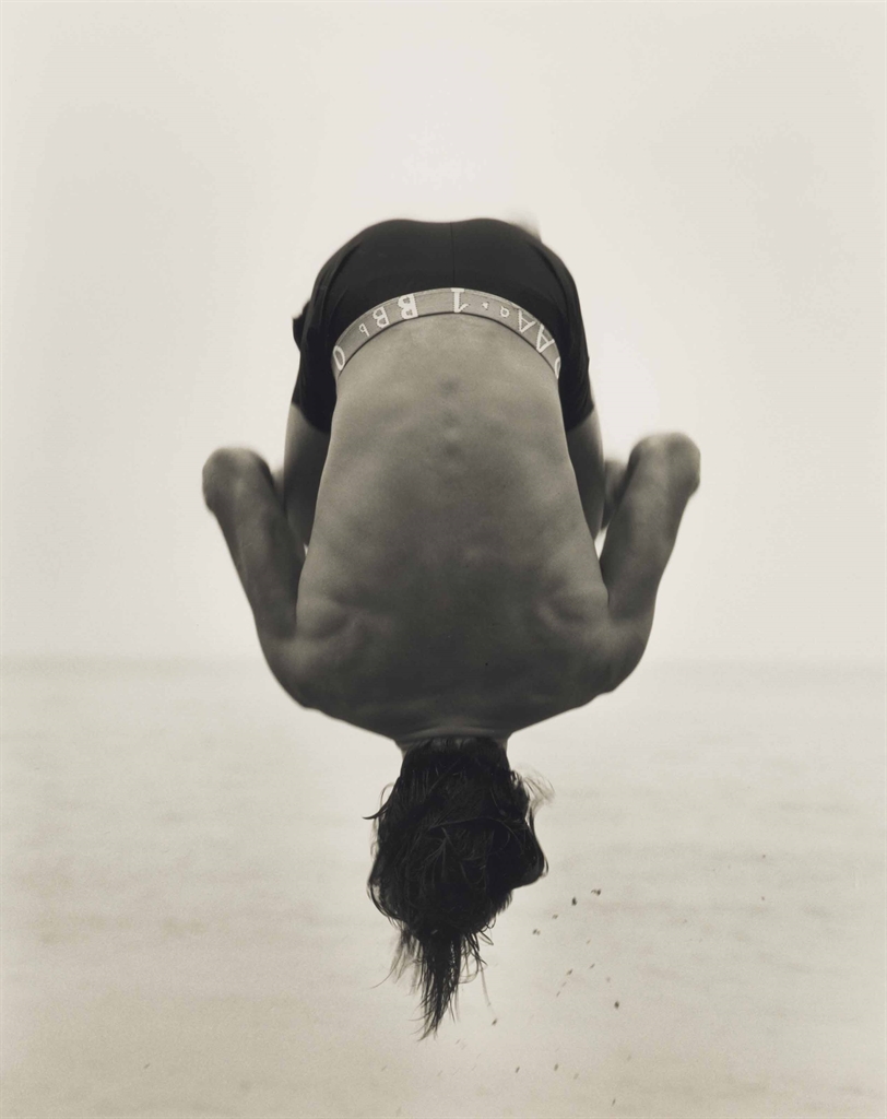 Herb Ritts (1952–2002), Backflip, Paradise Cove, 1987. Gelatin silver print. Estimate $40,000-60,000. This lot is offered in Photographs including Property Sold to Benefit the Elton John AIDS Foundation on 6 April 2017 at Christie’s in New York, Rockefeller Center