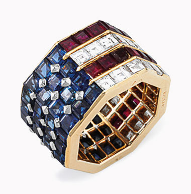 A diamond, sapphire and ruby ring, by Bulgari. Of octagonal shape, set with square-cut sapphires, rubies and diamonds in an American flag motif, ring size 5½, with French assay marks for platinum and 18k gold. Estimate $5,000-8,000. This lot will be offered in The Private Collection of President and Mrs. Ronald Reagan, 21-22 September at Christies in New York