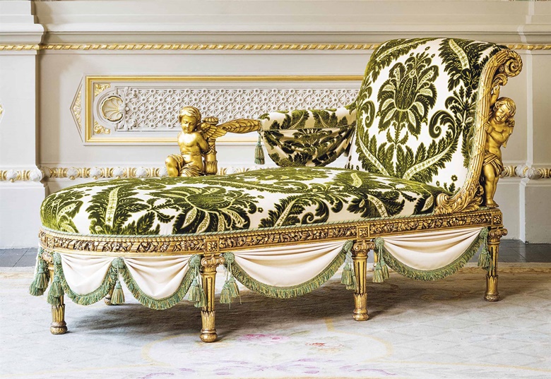 A French giltwood chaise longue by Henri-Auguste Fourdinois, Paris, circa 1878. Covered with green and cream-coloured cut silk velvet, the back of outscrolled form with one arm supported by a kneeling putto, the rounded base on seven column-form legs separated by fabric swags. 41½ in (105.5 cm) high; 75¾ in (192.5 cm) wide; 34¼ in (87 cm) deep. Sold for £47,500 on 7 June