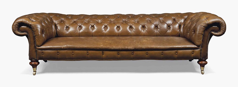 A late Victorian brown leather Chesterfield sofa. Late 19th century. 27 in (68.5 cm) high; 93 in (236.5 cm) wide; 39½ in (105 cm) deep. Sold for £3,250 on 20 July 2016