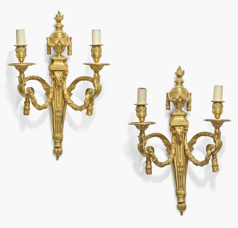 A pair of ormolu twin-branch wall appliques. Of Louis XVI style, after a model by Jean-Charles Delafosse, late 19th century. 19½ in (50 cm) high. Sold for £2,500 on 20 July 2016