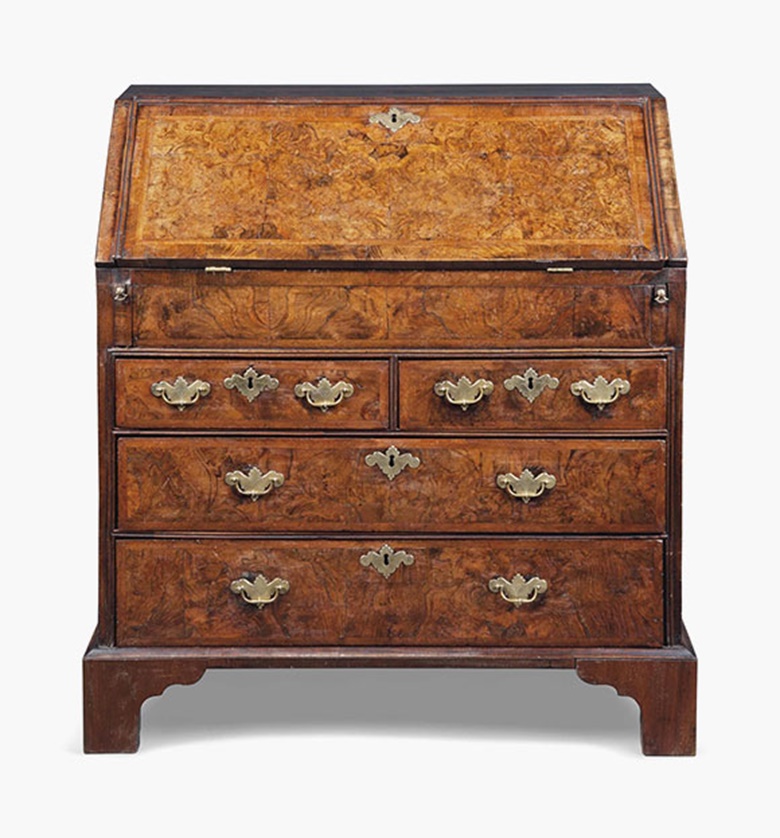 A Queen Anne cross-and-featherbanded burr-walnut bureau. Early 18th century. 40¼ in (102 cm) high; 38 in (97 cm) wide; 20 in (51 cm) deep. This lot was offered in Interiors on 20 July 2016 at Christie’s in London, South Kensington