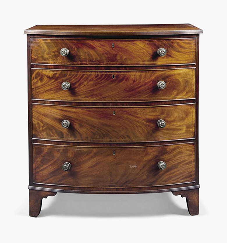 A Regency mahogany bowfront chest. Early 19th century. 41¼ in (105 cm) high; 38⅜ in (97.5 cm) wide; 23¾ in (60.5 cm) deep. This lot was offered in Interiors on 20 July 2016 at Christie’s in London, South Kensington