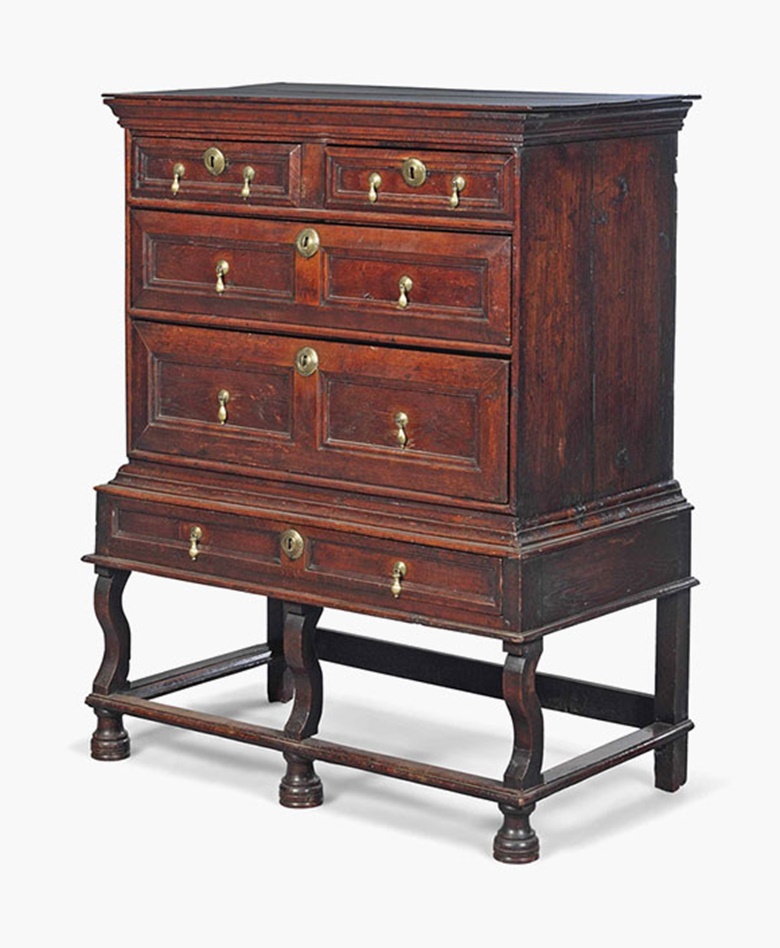 A William and Mary oak chest on stand. The chest late 17th century, the stand 19th century. 52 in (132 cm) high; 39½ in (101 cm) wide; 22½ in (57 cm) deep. Sold for £2,125 on 20 July 2016