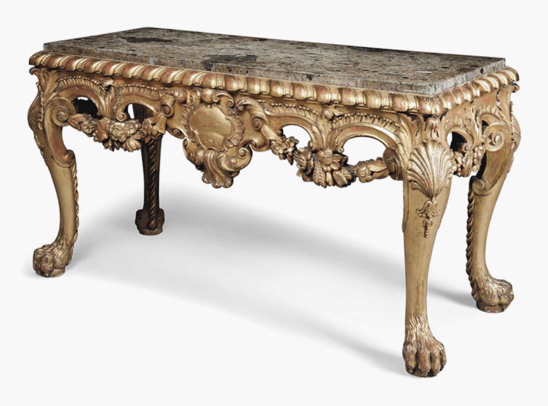 An English giltwood side table. Of George II style, late 19thearly 20th century. 32¾ in (83 cm) high; 59 in (150 cm) wide; 25½ in (65 cm) deep. This lot was offered in Interiors on 20 July 2016 at Christie’s in London, South Kensington