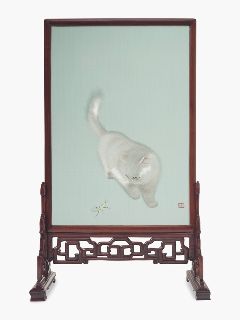 A Chinese embroidered silk screen mounted in a carved wood stand, circa 1984. The embroidery depicting a white cat playing with mantis. 26 ¼ (66.6 cm) high, 14 ⅝ in (37.1 cm) wide. Estimate $3,000-5,000. This lot will be offered in The Private Collection of President and Mrs. Ronald Reagan, 21-22 September at Christies in New York