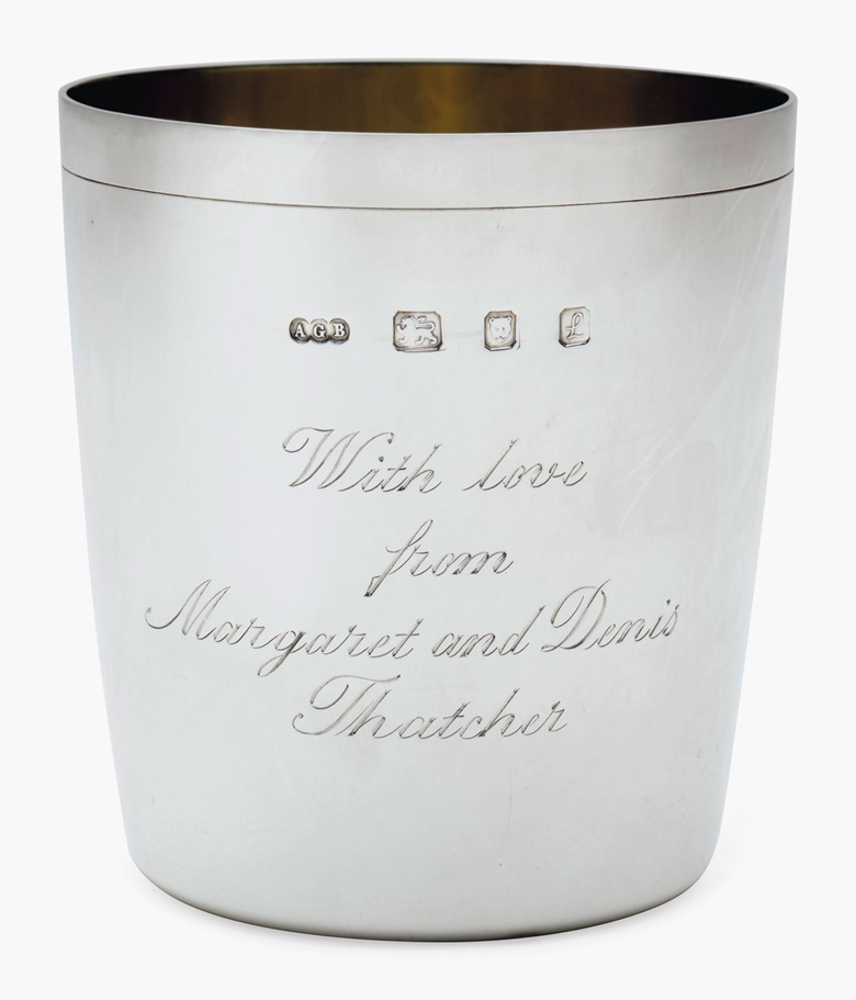 A pair of Elizabeth II silver beakers, Mark of Gerald Benney, London, 1985 and 1990. Each with gilt interior, inscribed ‘With love from Margaret and Denis Thatcher’ to one side, the reverse each with an initial R or N, marked Gerald Benney, London on base, and marked on rim. 3 ⅜ in (8.6 cm) high; 11 oz 10 dwt (360 g). Estimate $1,000-2,000. This lot will be offered in The Private