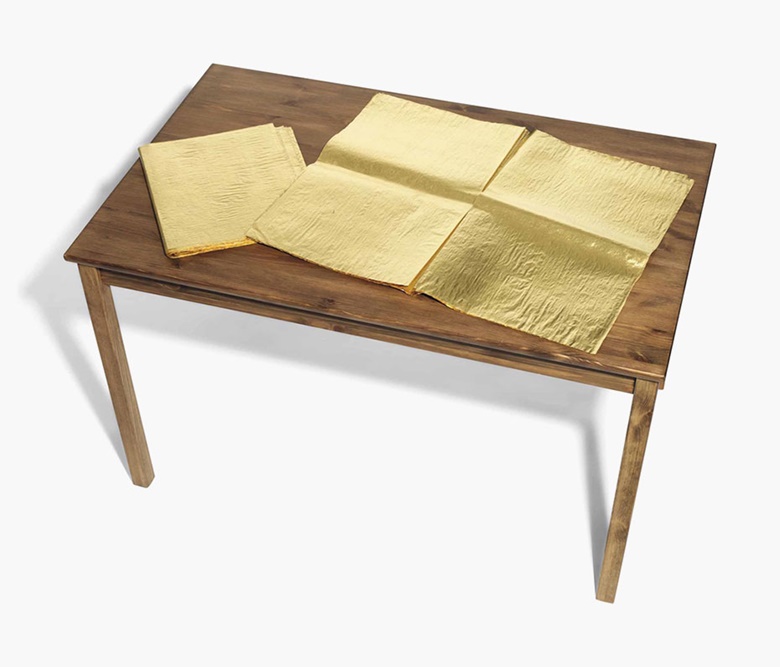 Jim Hodges (b.  1957), The Good NewsLondon Guardian. 24-carat gold leaf on newspaper and wood table, closed newspaper 15⅛ x 13⅝ in (38.5 x 34.5 cm), open newspaper 23⅝ x 29⅝ in (60 x 75.3 cm), overall 47¼ x 29⅛ x 29½ in (120 x 74 x 75 cm). Estimate £15,000-20,000. This lot is offered in Post-War & Contemporary Art Day Auction on 7 October 2016 at Christie’s in London,