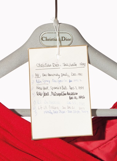 A label documents where and when Mrs. Bloomingdale wore this Christian Dior couture red crepe gown