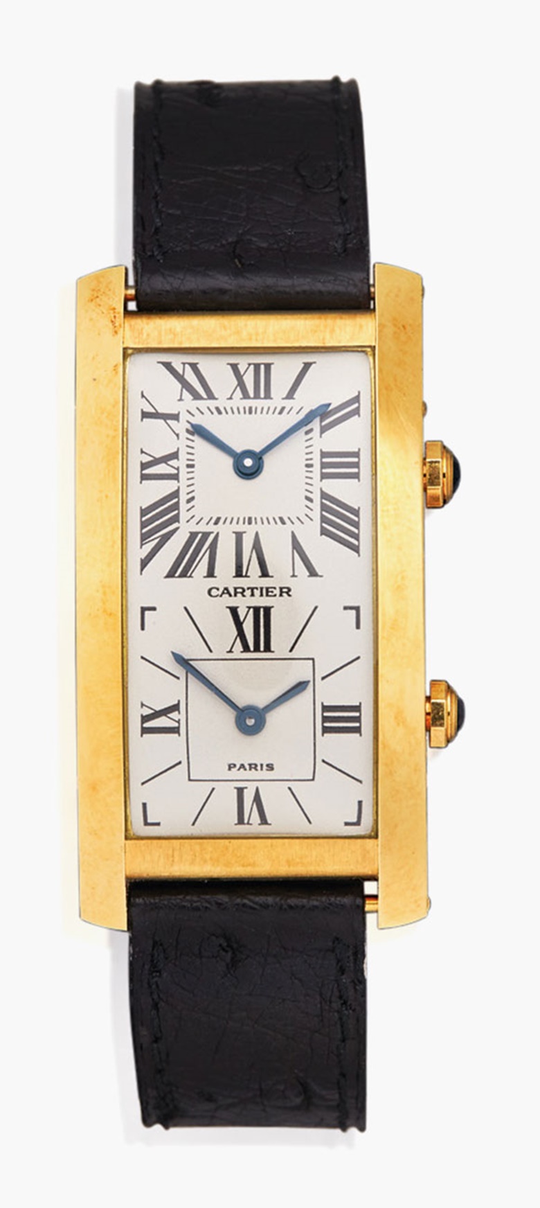 A dual-time ‘Tank Cintrée’ wristwatch, by Cartier. The rectangular cream slightly bombé dial with two dials within a polished gold bezel, the first dial with Roman numerals, inner minute railway and blued steel hands, the second with Roman numeral quarters, baton hour markers and blued steel hands, to the sapphire-set crown and deployant clasp, mechanical movement, case