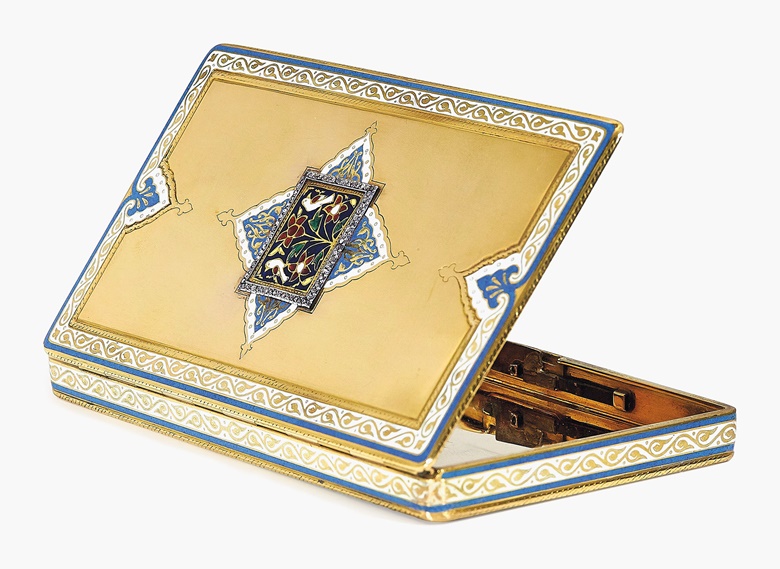 An early-20th-century gold and multi-gem cigarette case, circa 1929, by Lavabre for Cartier. Of rectangular outline, the centre applied with an Indian multicoloured motif enhanced with rose-cut diamonds, the outline of similar white and blue enamel Indian design, the push-piece set with sapphires, 10 x 6.4 cm, 163 gr. Estimate SFr.20,000-30,000. This piece is offered in Magnificent Jewels on 17