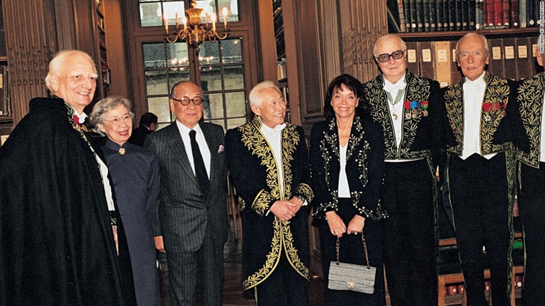 Elected to the Académie des Beaux Arts, Zao Wou-Ki (centre) stands in the library of the institute, in 2003. Reserved Rights
