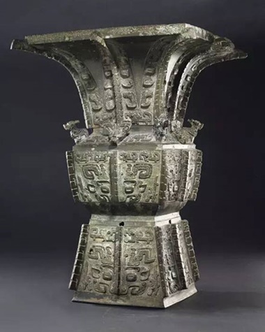 A  magnificent and highly important bronze ritual wine vessel, Fangzun late Shang Dynasty, Anyang period, 12th–11th century B.C. 20⅝ in (52.4 cm) high, gold and silver-inlaid wood  stand, Japanese double wood box. Estimate $6,000,000–8,000,000. This work will be offered in Important Chinese Art  from the Fujita Museum, New York, 16 March 2017