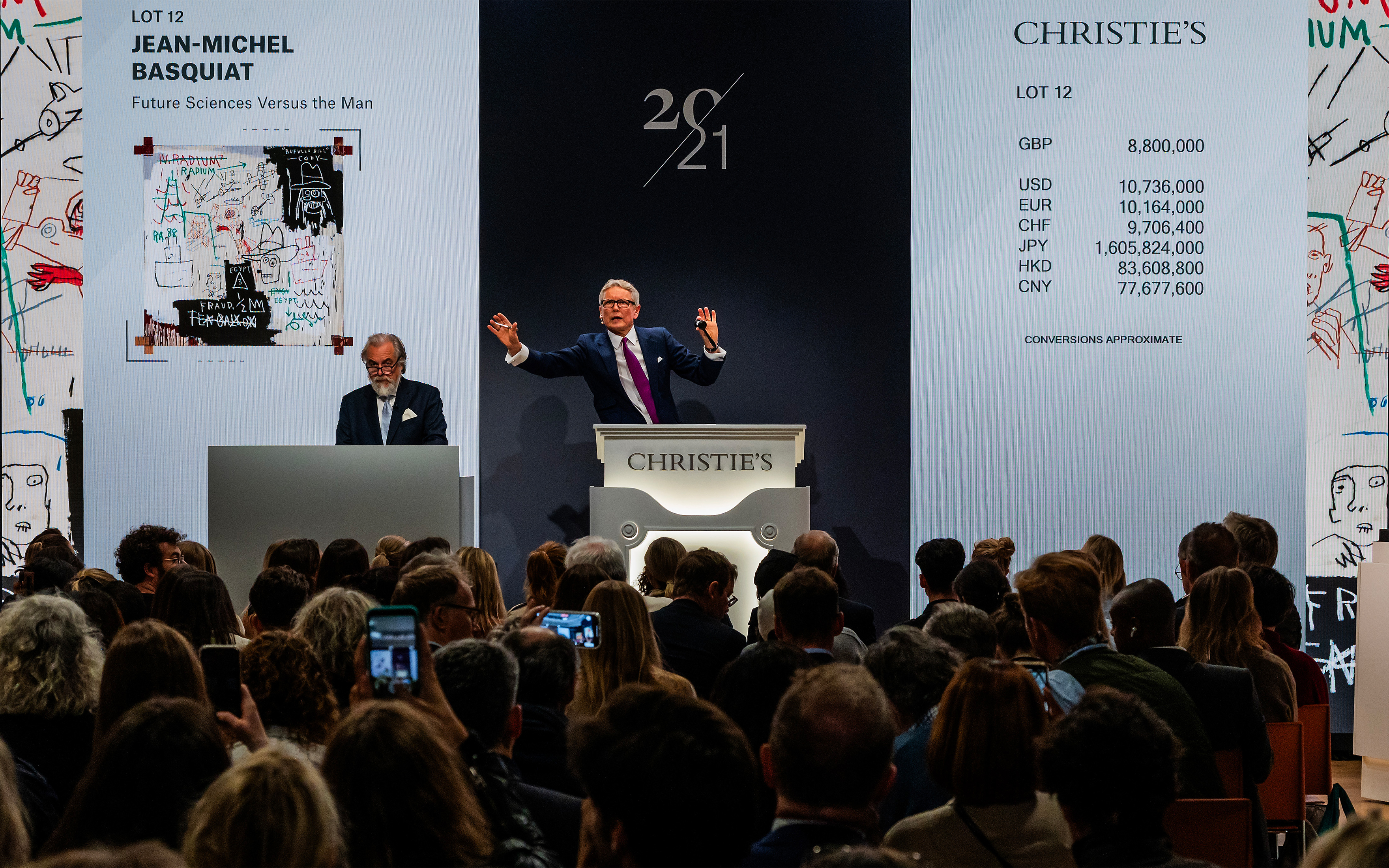 Christie’s Global President Jussi Pylkkänen at the rostrum with Jean-Michel Basquiat's Future Sciences Versus the Man (1982). The work sold for £10,430,000 on 13 October 2023 at Christie’s in London