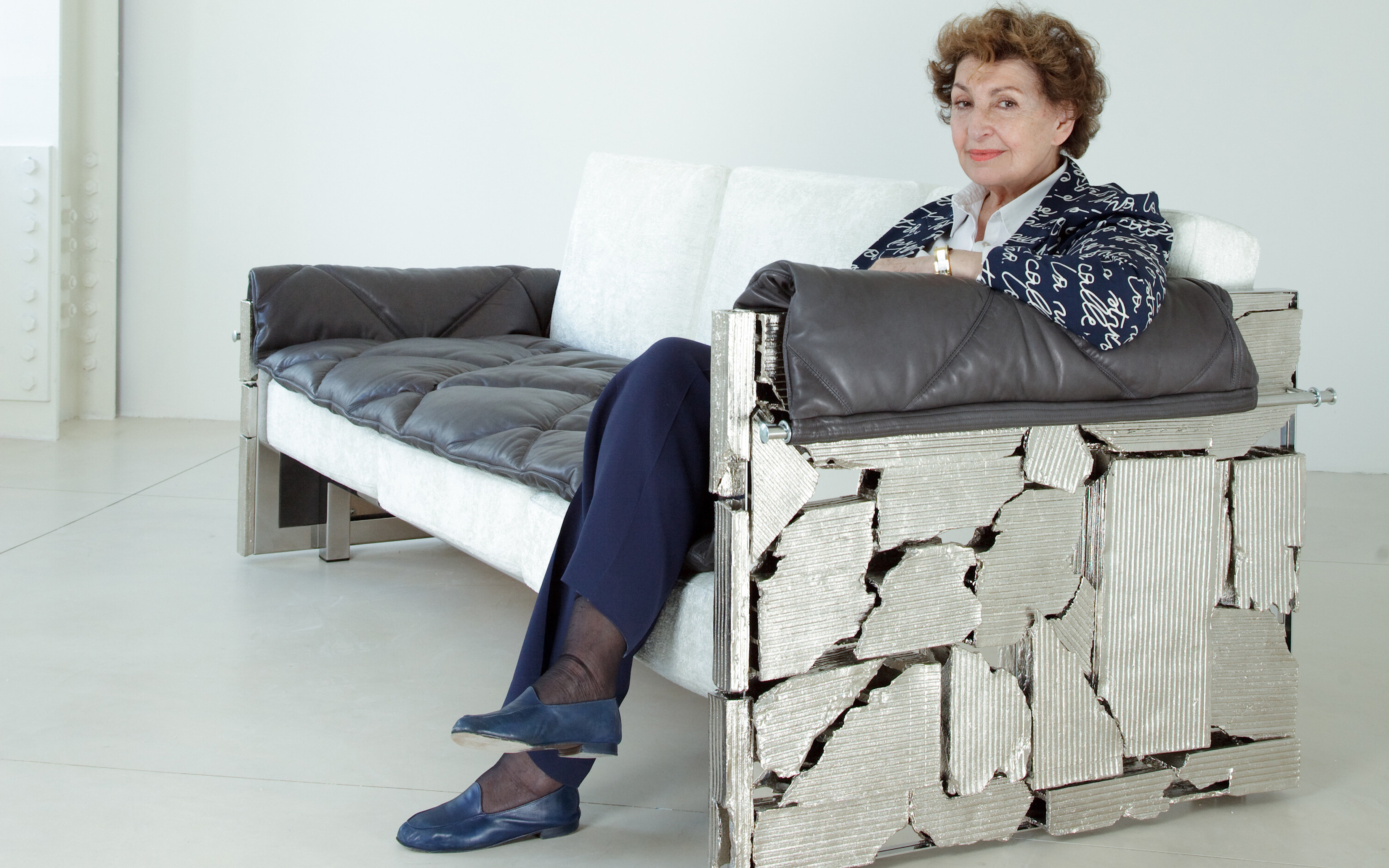 Maria Pergay on her Brick bench at Demisch Danant gallery, New York, in 2010