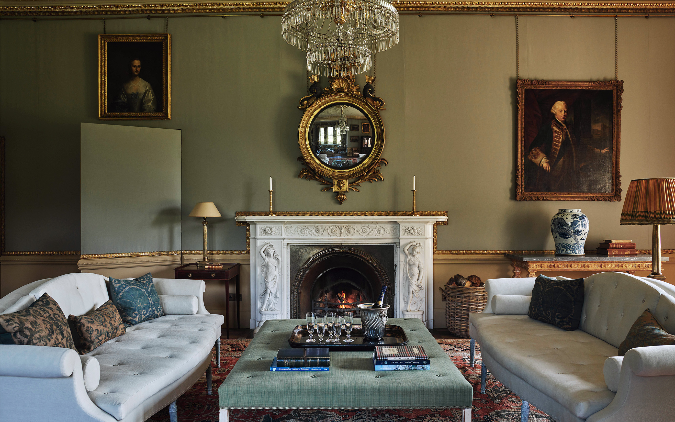 Jamb's first major interior design project was Aldourie Castle in Scotland: 'We did all the furniture, objects, carpets and fabrics completely from scratch,' says Fisher. Above the chimneypiece in the Drawing Room is a Regency giltwood mirror by Thomas Fentham. The two Hardwicke sofas by Jamb were reproduced from a George III original