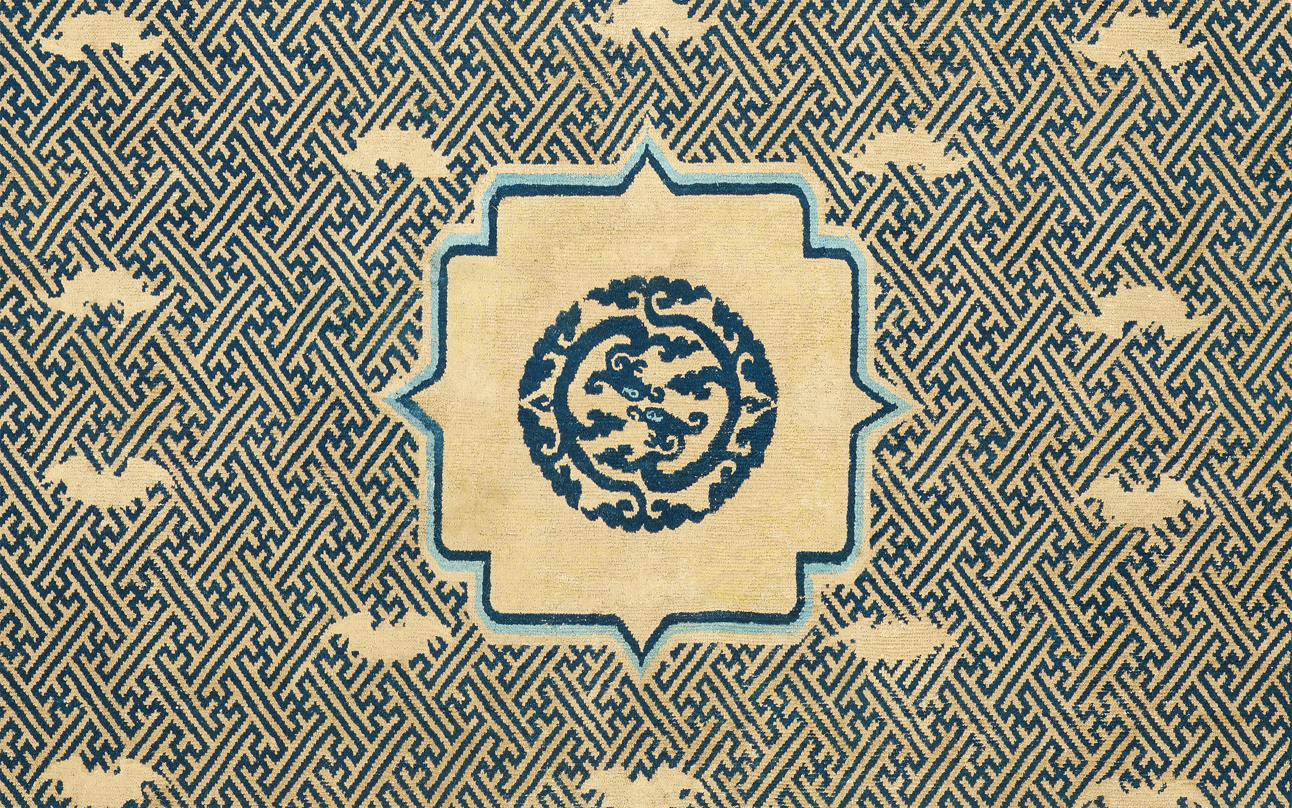A bat and fret-work kang carpet, Ningxia, north China, Qing dynasty, last quarter 17th century, offered in Art of the Islamic and Indian Worlds including Rugs and Carpets on 1 May 2025 at Christie's in London