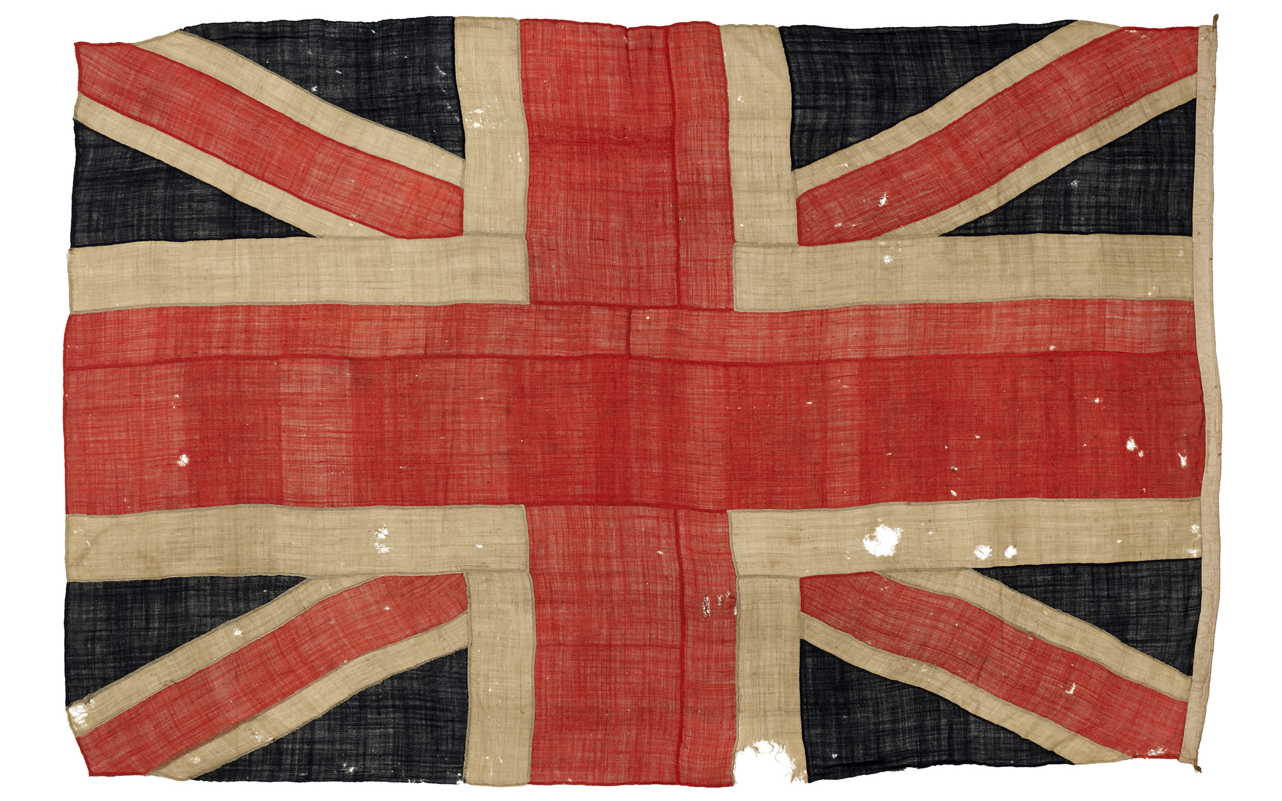 A Union Jack flown from HMS Spartiate at the Battle of Trafalgar, 21 October 1805. A yard- or shipboard-hand-stitched wool-bunting flag, comprised of 31 bunting panels with canvas sleeve and lanyard, on an archival muslin backing, offered in The Exceptional Sale on 1 July 2025 at Christie's in London