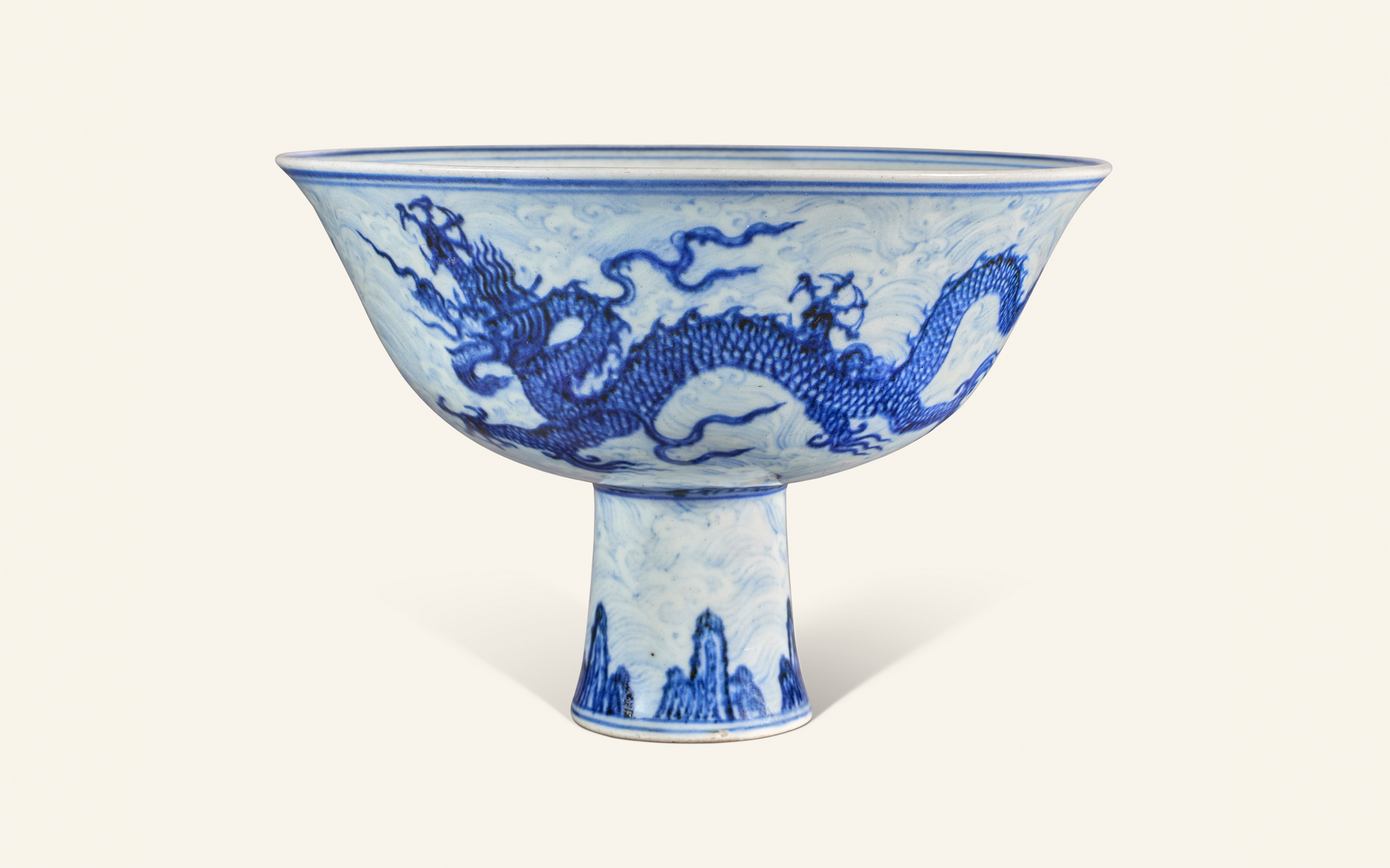 A rare and important anhua-decorated blue-and-white Dragon stem bowl. China, Ming dynasty, Xuande six-character mark within a double circle in underglaze blue and of the period (1426-1435), offered in Art d'Asie on 10 June 2025 at Christie's in Paris