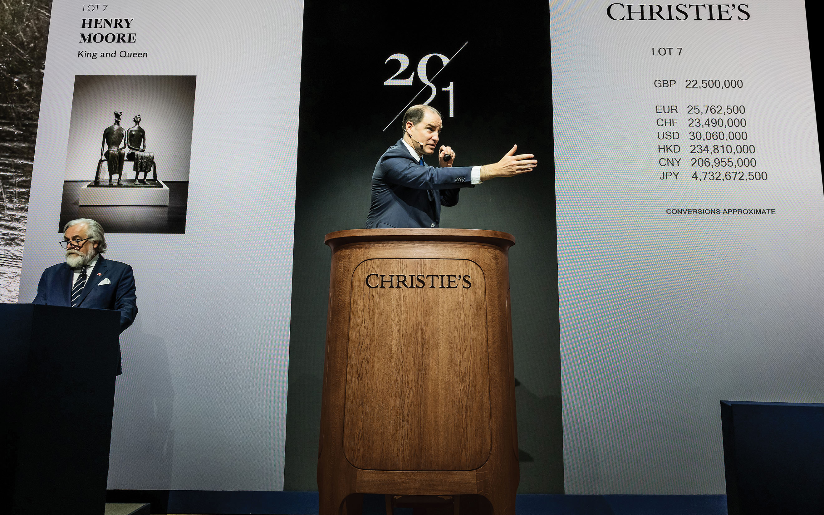 Adrien Meyer, Global Head of Private Sales and Co-Chairman, Impressionist & Modern Art, selling Henry Moore's King and Queen in the new Christie's rostrum, redesigned by Sir Jony Ive and his team at LoveFrom