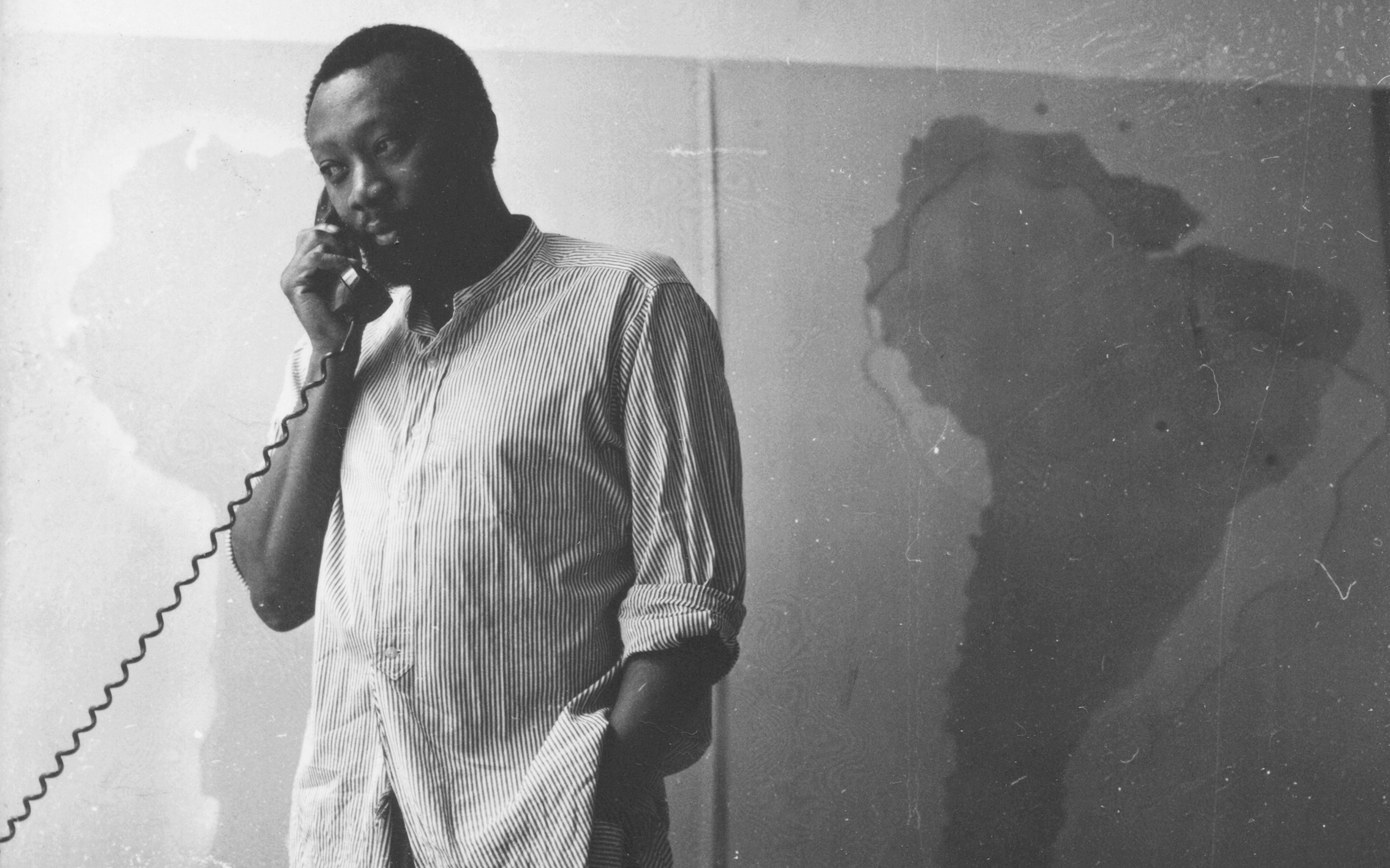 Frank Bowling in his studio at 535 Broadway, New York, in 1967, in front of one of his Map Paintings