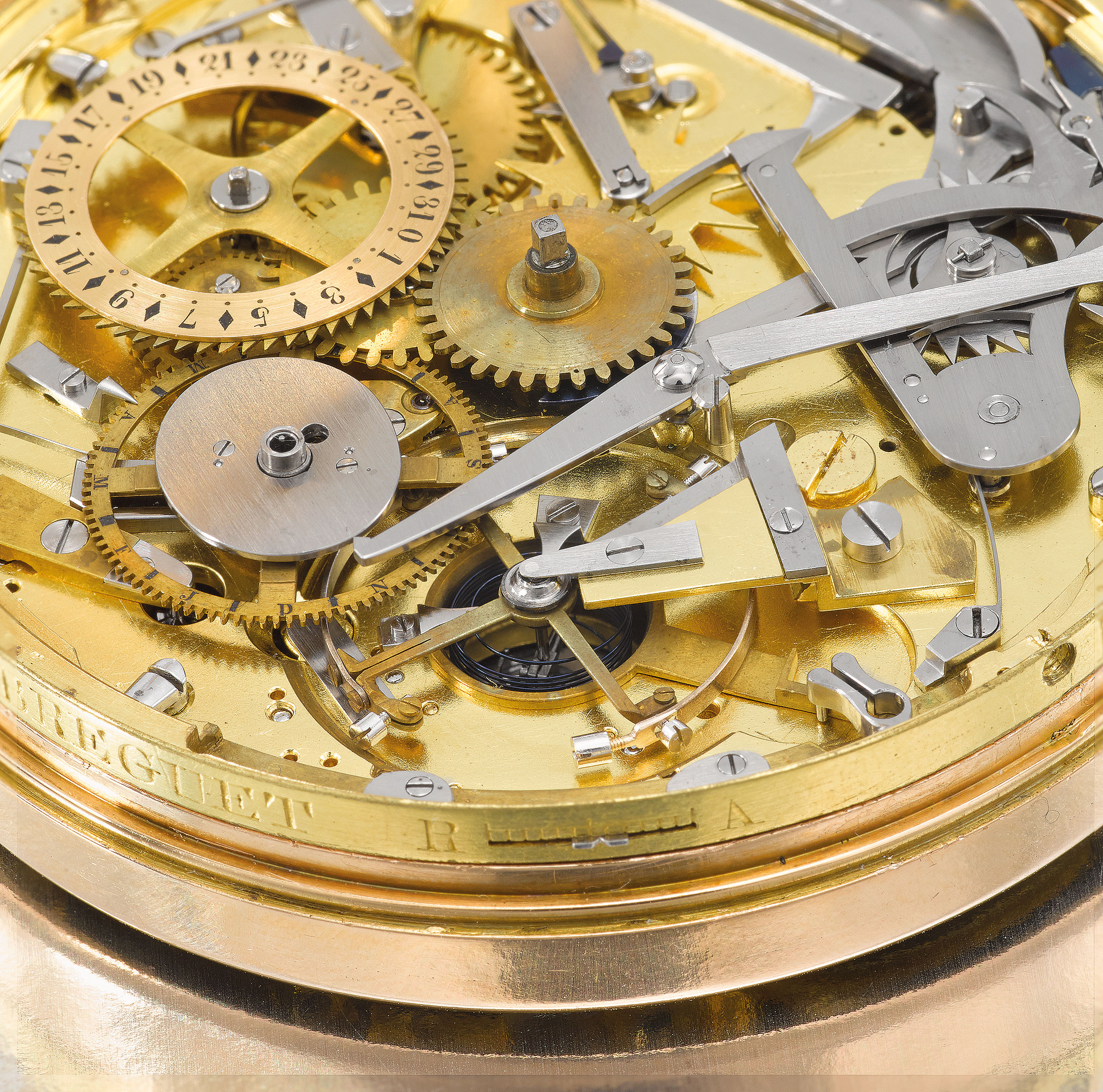 A detail of the movement under the dial on Breguet No. 217