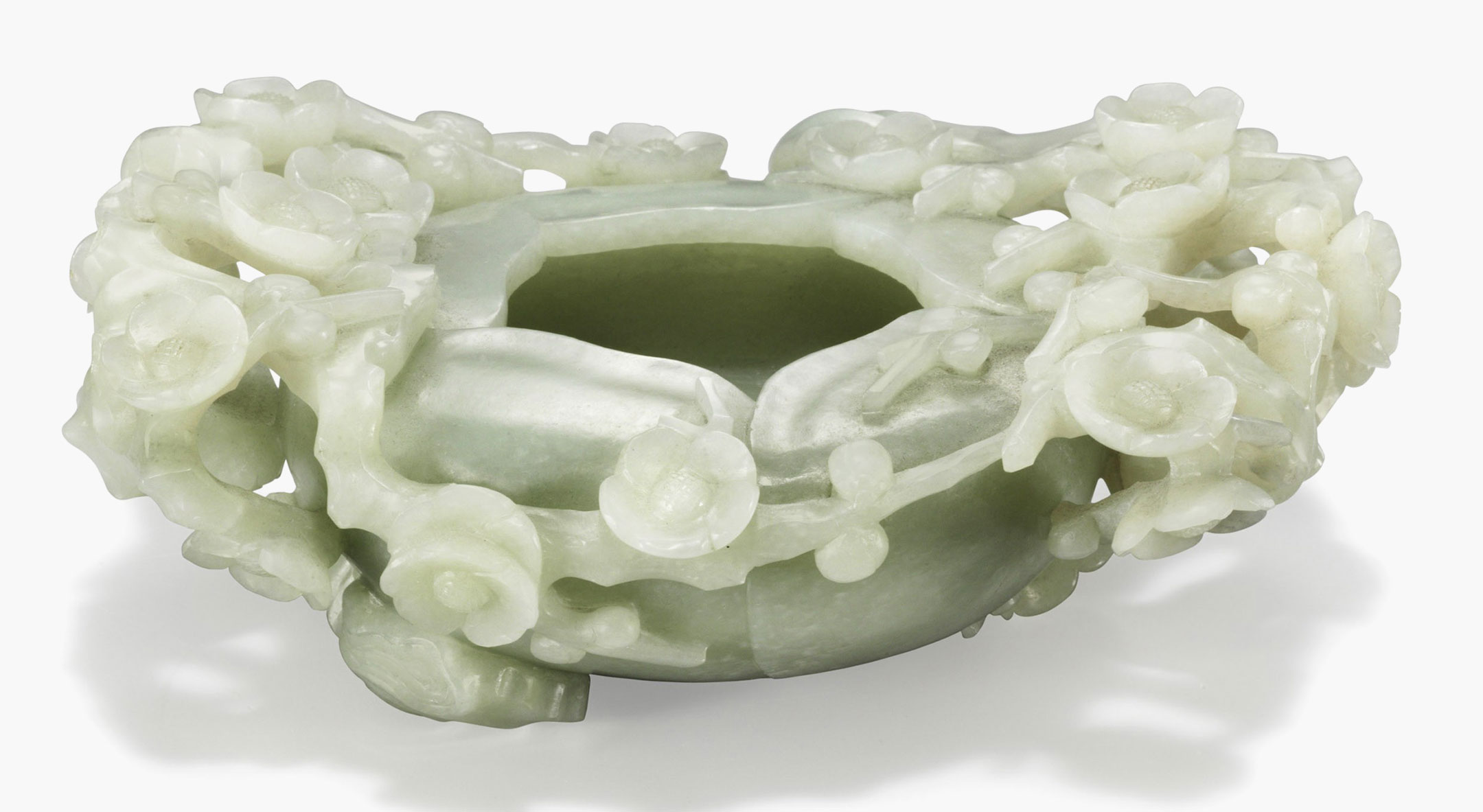 A greenish-white jade carved brush washer. China, 18th &ndash; 19th century. 7 1/4 in. (18.5 cm.) wide. Estimate: $5,000&ndash;7,000. This work is offered in the Asian Art Inspired by Nature online auction on 19&ndash;28 April