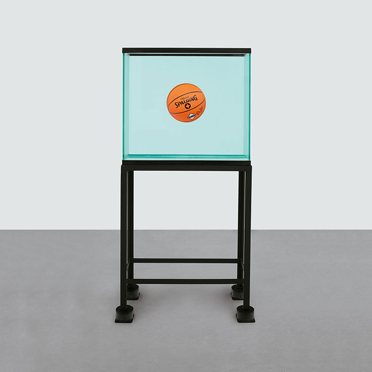 Jeff Koons (b. 1955), One Ball Total Equilibrium Tank (Spalding Dr. J Silver Series), 1985. Glass, steel, sodium chloride reagent, distilled water and basketball. 64 3/4 x 32 3/4 x 15 1/2 in. (164.6 x 83.1 x 39.3 cm.) This work is number one from an edition of two. Estimate: Upon request. This work is offered in Bound to Fail on 8 May at Christie’s New York