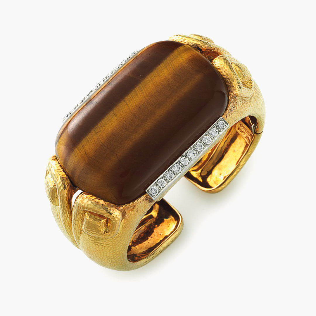 A Tiger’s eye quartz, diamond and gold sautoir, by David Webb. Estimate: $10,000-15,000. 