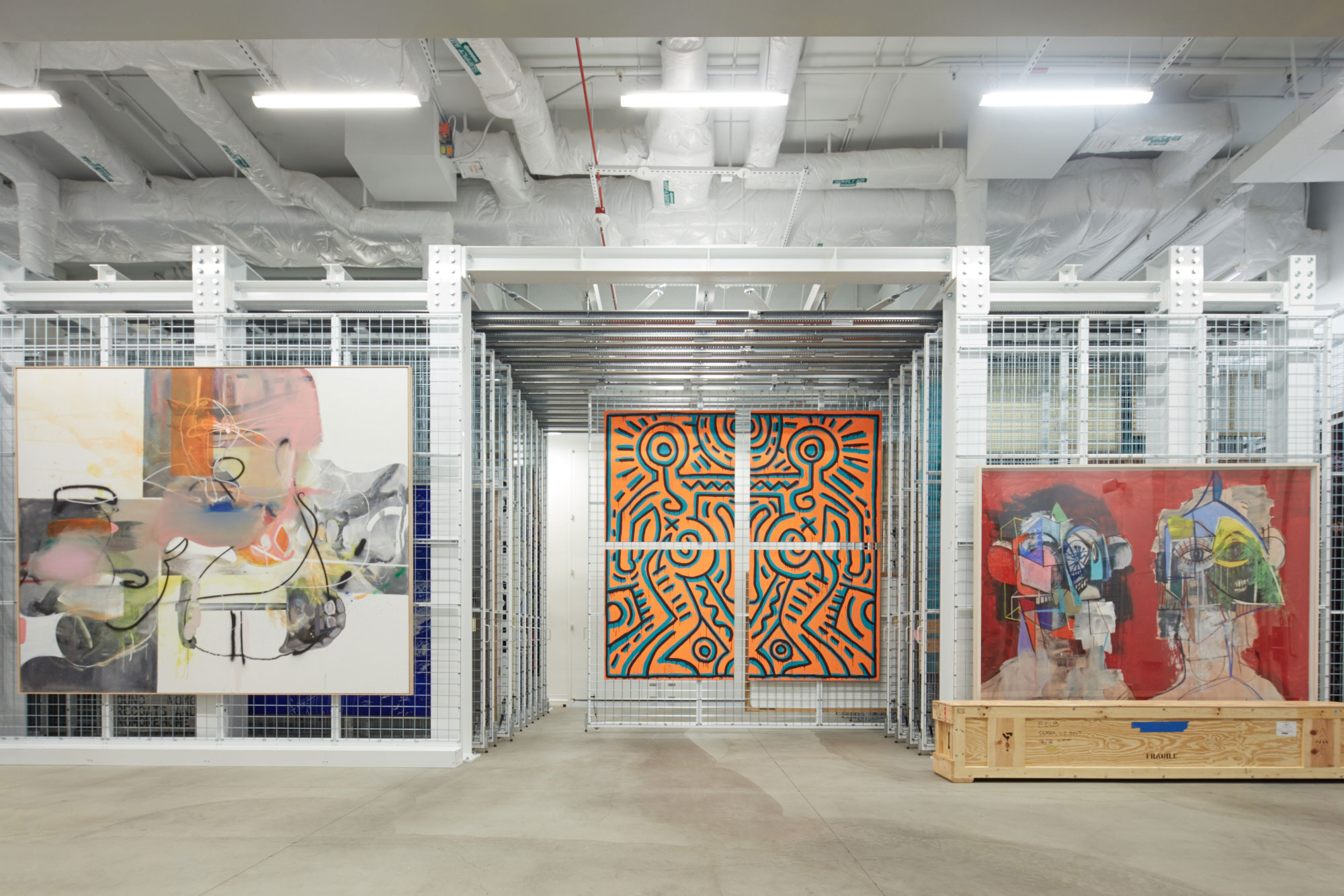 The Vault at The Broad, from left: Albert Oehlen, Abstand, 2006; Keith Haring, Untitled, 1984; George Condo, Double Heads on Red, 2014. © Albert Oehlen. Keith Haring artwork © Keith Haring Foundation. © ARS, NY and DACS, London 2016