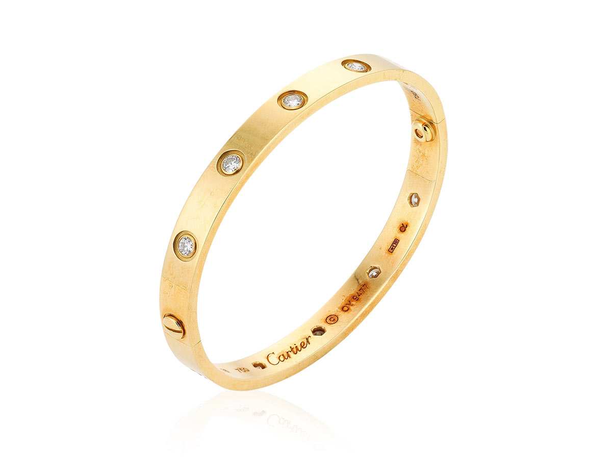 Cartier diamond 'Love' bangle. Designed as a gold bangle set with ten round diamonds, accompanied by a screwdriver. Estimate: HKD $15,000–25,000