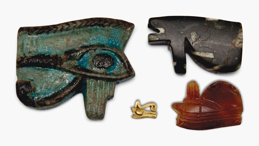 Four wedjet-eye amulets. Egypt, Late Period-Ptolemaic Period, c. 664-30 B.C. 1&frac34; in (4.5 cm) long, and smaller. Estimate: &pound;1,500-2,500. This lot is offered in Seward Kennedy's Cabinet of Curiosities and The Tony Robinson Collection of Treen Drinking Vessels on 22 November 2016 at Christie&rsquo;s in London, South Kensington