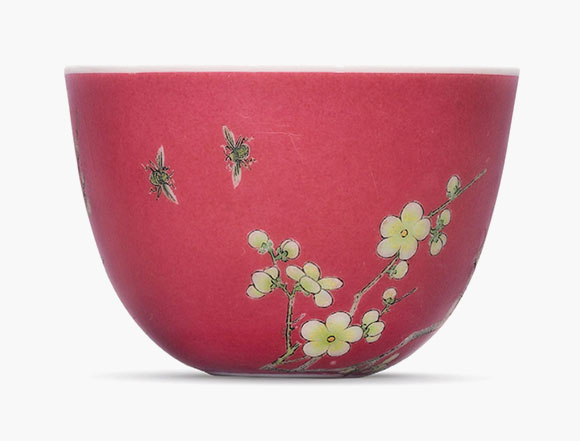 A fine and highly important falangcai ruby-ground ‘prunus’ cup. Yongzheng four-character mark in blue enamel and of the period (1723-1735). Estimate: HK$40,000,000-50,000,000. This work is offered in the Important Chinese Ceramics and Works of Art sale on 30 November at Christie’s Hong Kong