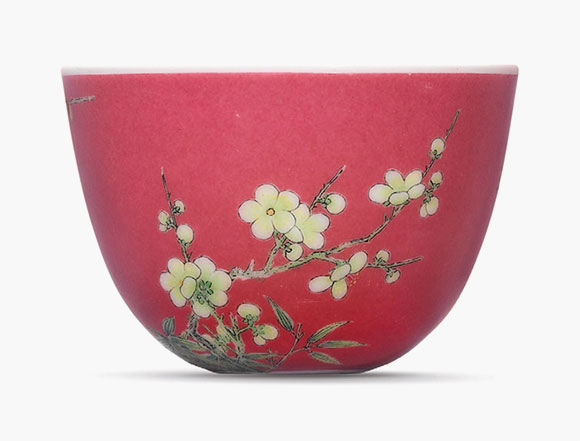 A fine and highly important falangcai ruby-ground ‘prunus’ cup. Yongzheng four-character mark in blue enamel and of the period (1723-1735). Estimate: HK$40,000,000-50,000,000. This work is offered in the Important Chinese Ceramics and Works of Art sale on 30 November at Christie’s Hong Kong