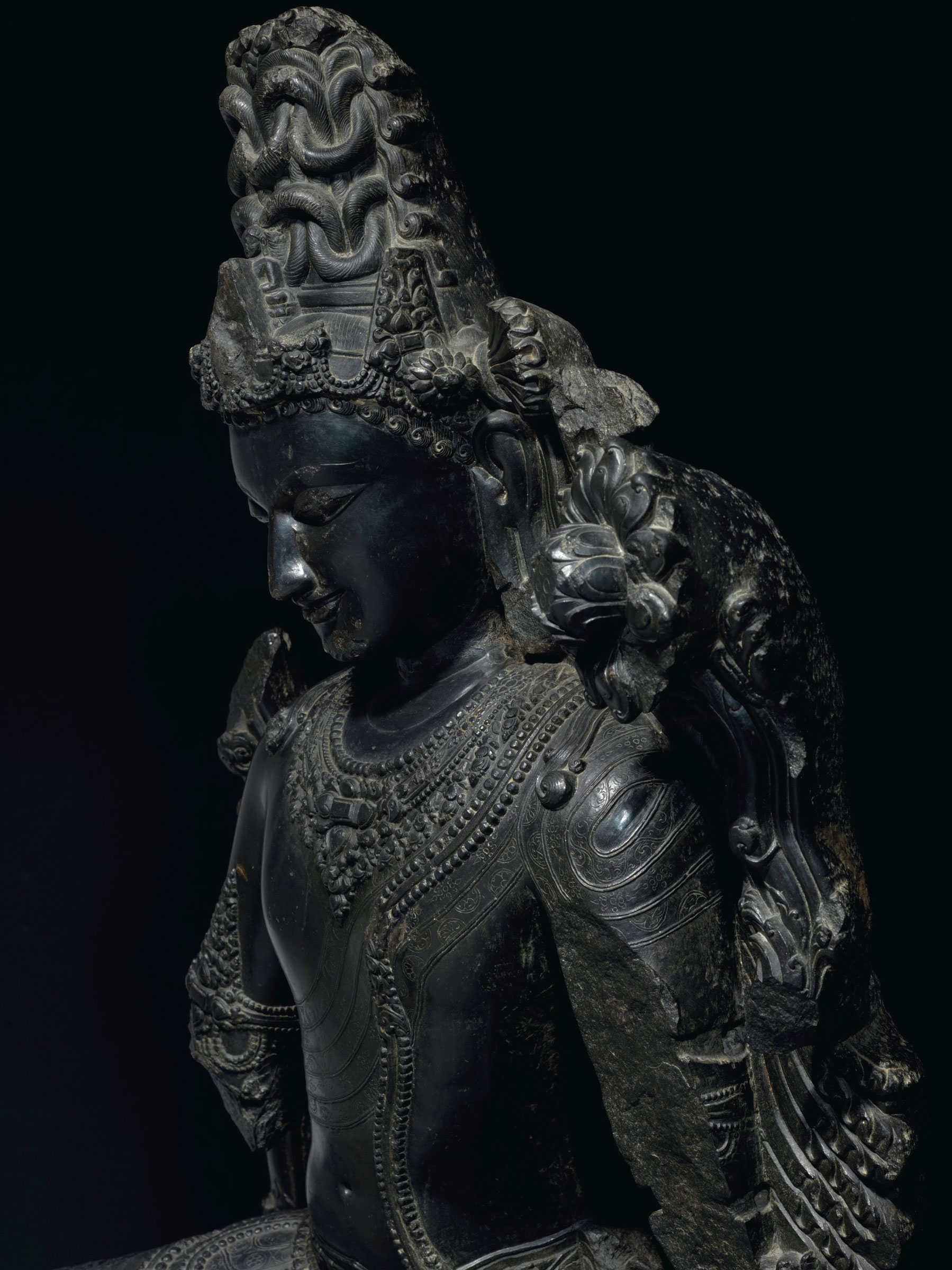 Carved in exceptional detail, the black stone &mdash; identified as schist &mdash; is familiar to the region of West Bengal and Bangladesh and could easily be mistaken for polished onyx or bronze