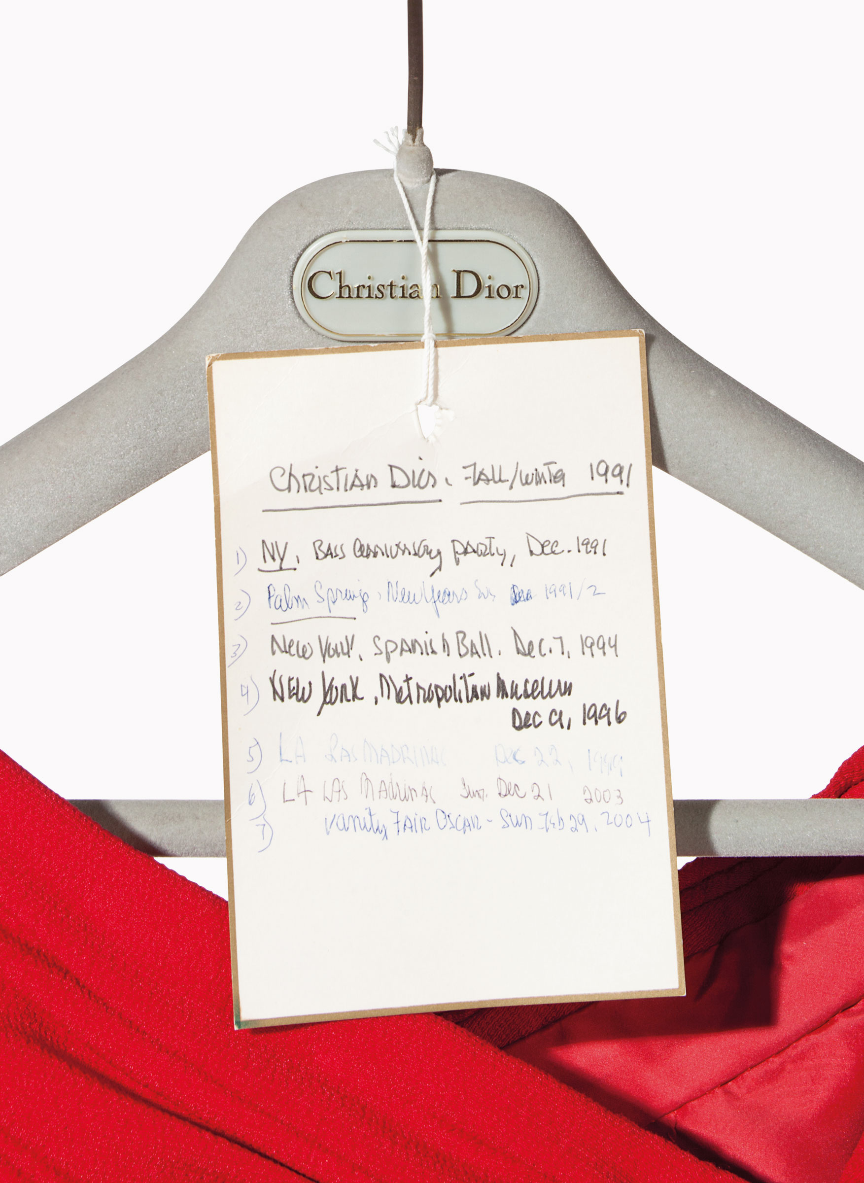 


A label documents where and when Mrs. Bloomingdale wore this Christian Dior couture red crepe gown
