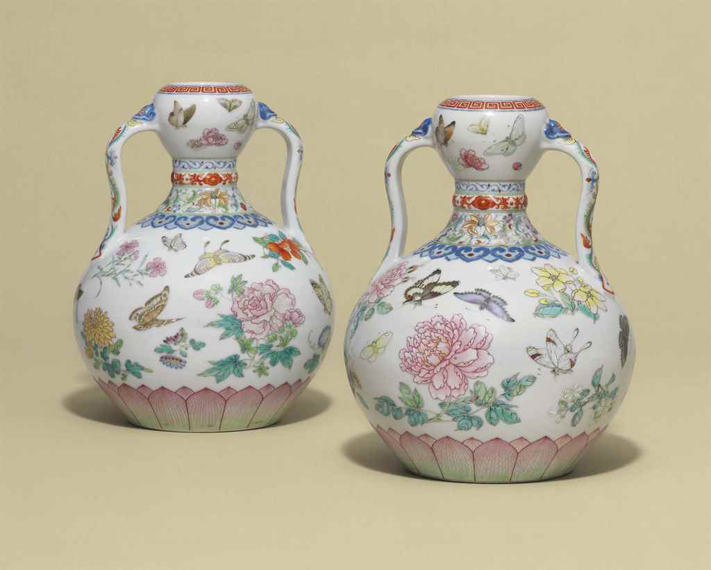 A magnificent pair of famille rose 'butterfly' double-gourd vases, Qianlong six-character seal marks in underglaze blue and of the period (1736-1795). 9 in (23 cm) high. Sold for: £14,725,000 in Fine Chinese Ceramics and Works of Art on 9 May at Christie’s London