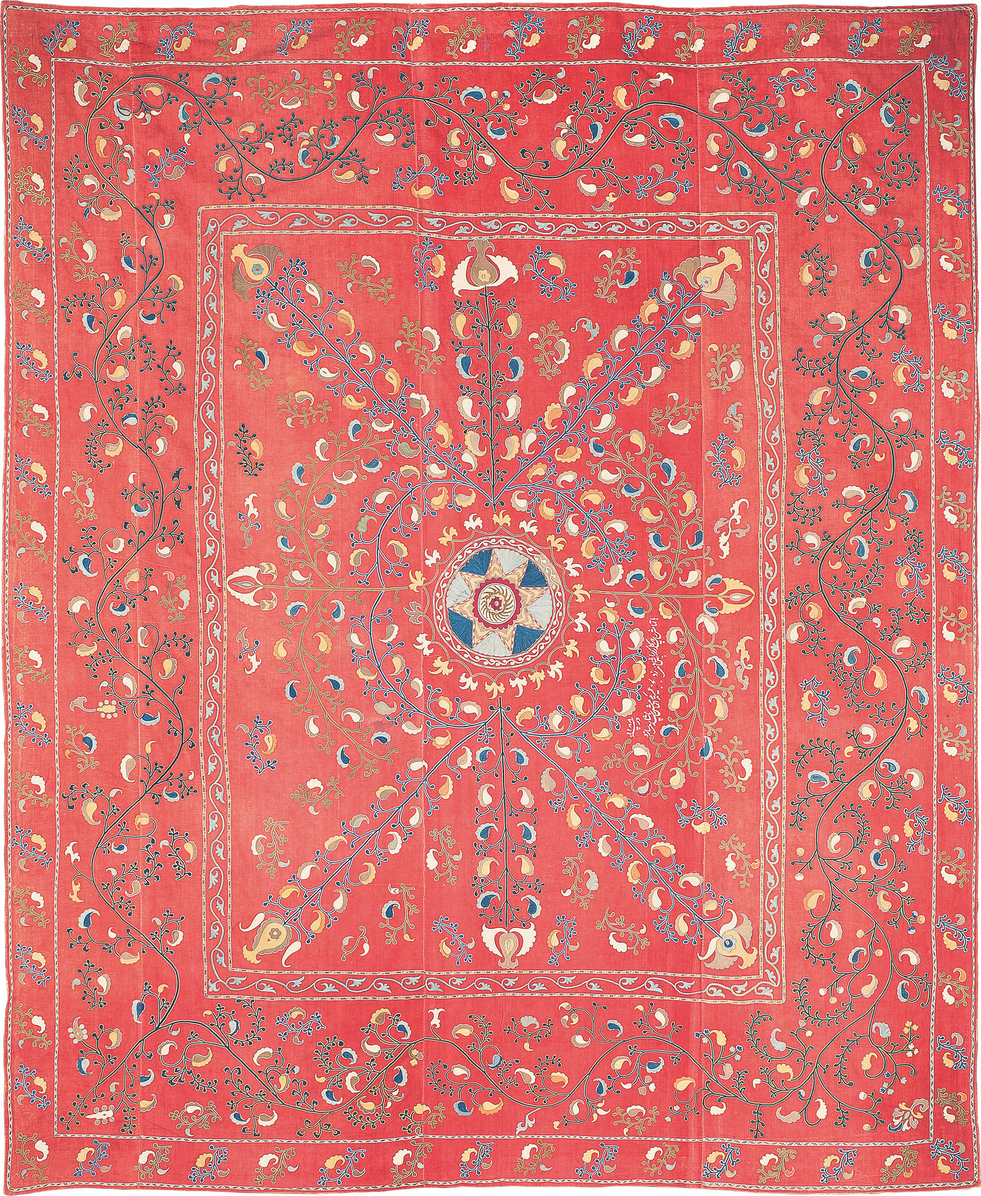 A suzani, Ura Tube region, Tajikistan, 1871. Near square form, embroidered decoration of foliate stems bearing floral buds radiating from central star motif framed with scrolling tendrils, borders with stylised foliate patterns, white embroidered Persian inscription in nasta'liq script. 109 x 89½ in (277 x 227.5 cm). Sold for £5,250 at Arts & Textiles of the Islamic & Indian Worlds, April 2015, London, South Kensington