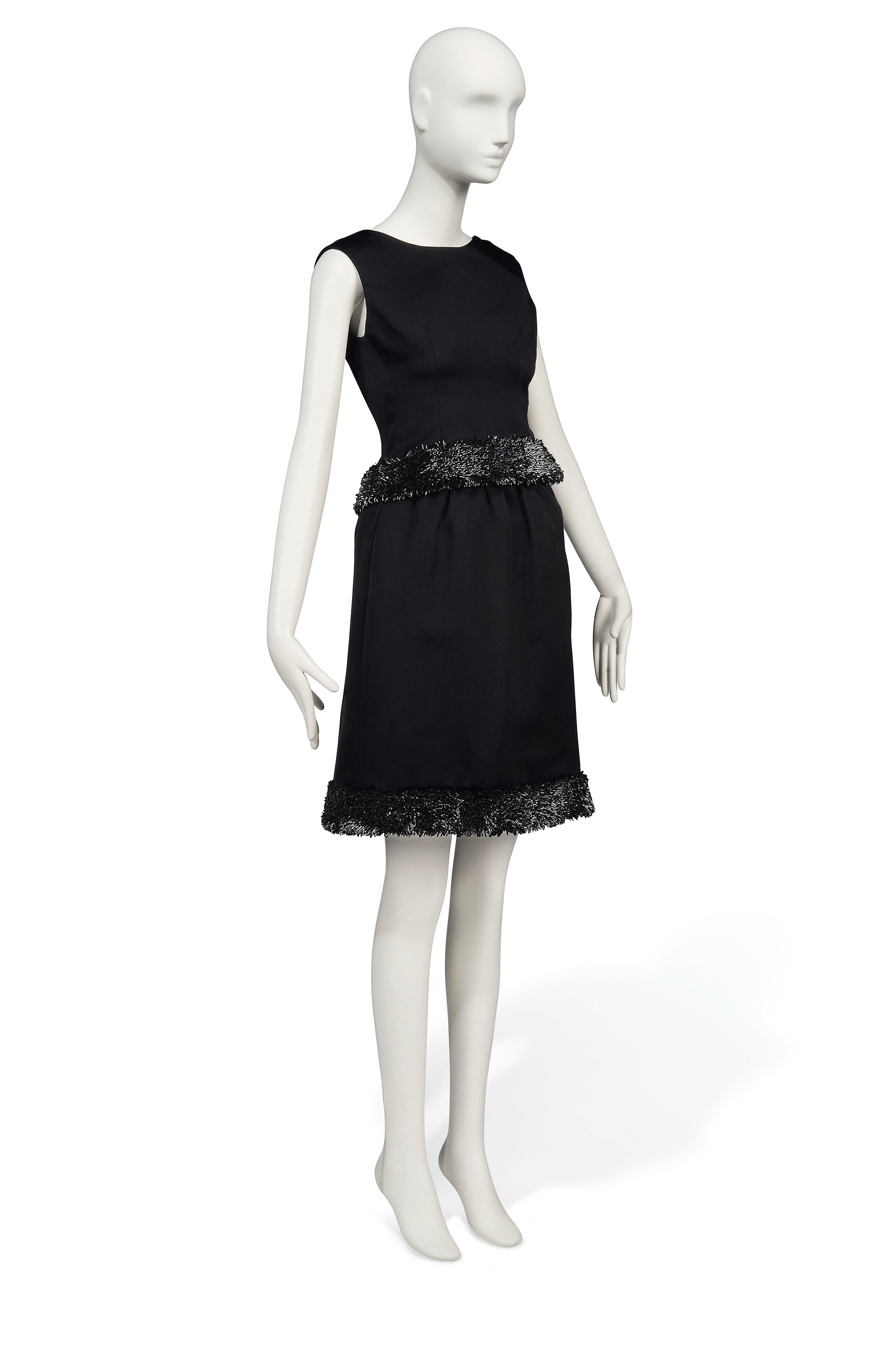 Charade, 1963
a cocktail gown of black satin, Givenchy couture, the two piece ensemble comprising a fitted bodice and skirt, each with a hem of semi-tubular black paillettes, set on edge, with multiple canvas tags to the interior, as well as black woven label with canvas tag inscribed 23174, designed for Audrey Hepburn as Regina "Reggie" Lampert in the 1963 Universal production Charade. Estimate: £50,000-80,000. This lot is offered in Audrey Hepburn: The Personal Collection on 27 September 2017 at Christie’s in London