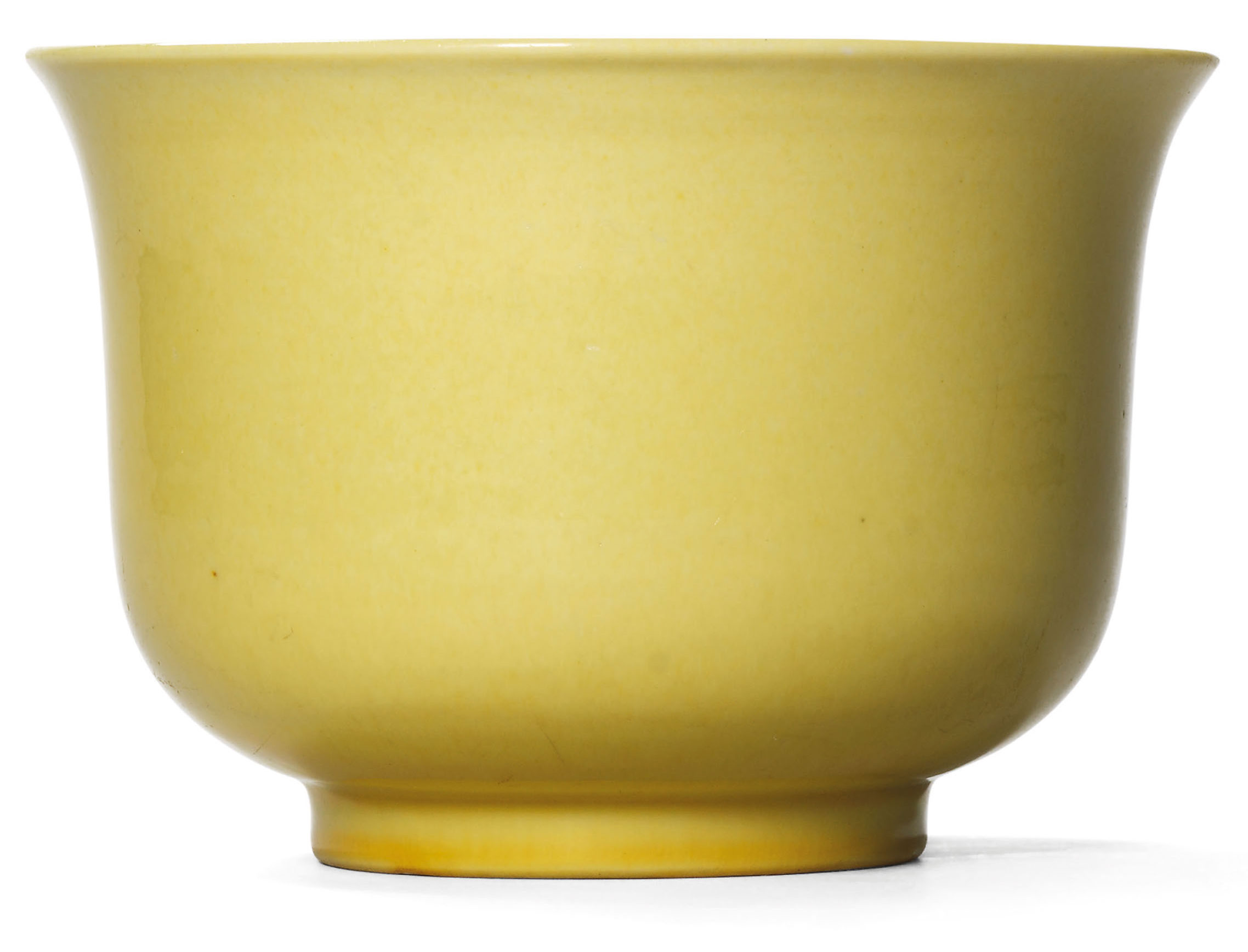 A fine and extremely rare yellow-enamelled bowl, Xuande incised six-character mark within a double circle and of the period (1426-1435). 6 in (15.2 cm) diam. Sold for HK$1,670,000 on 25 October 1993 at Christie’s in Hong Kong