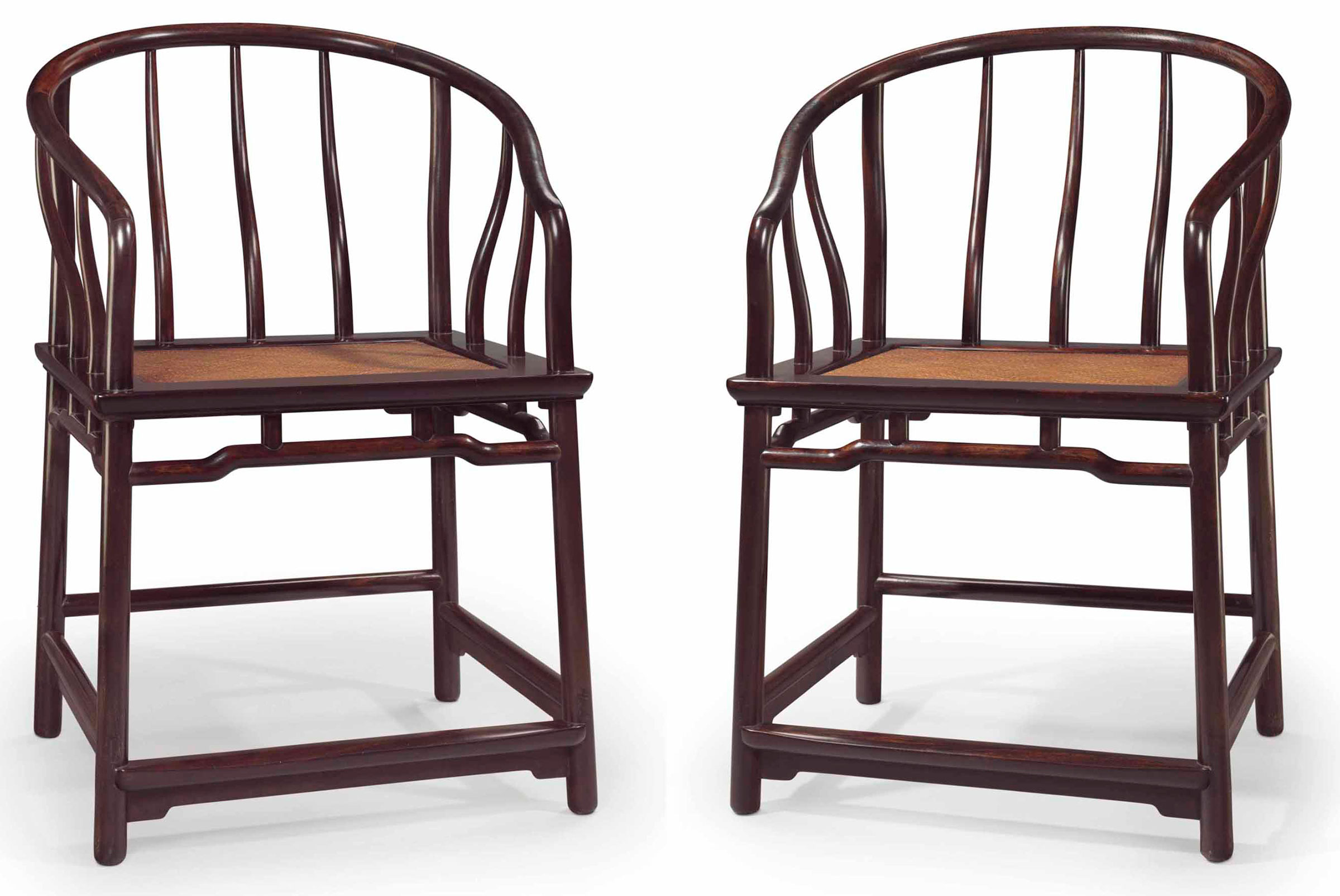 A very rare pair of zitan horseshoe-back armchairs, quanyi, 17th/18th century. 36 1/16 in (91.7 cm) high; 25 in (63.5 cm) wide; 22¾ in (58.1 cm) deep. Sold for $1,085,000 on 20-21 March 2014  at Christie’s in New York