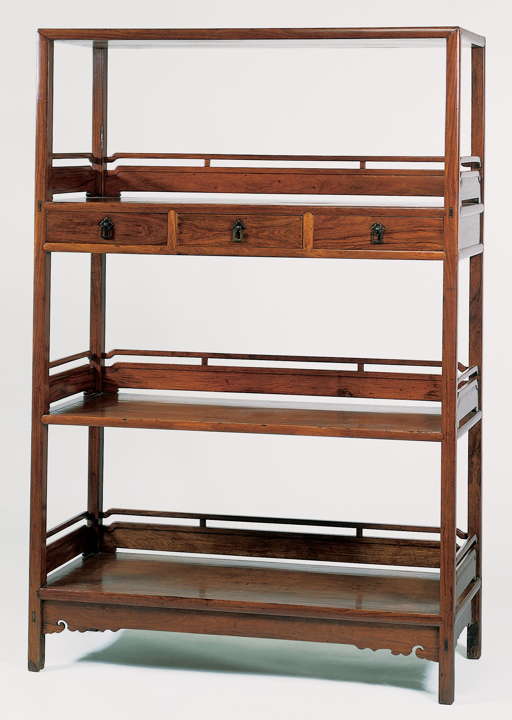 A huanghuali three-shelf bookcase, jiage, 17th century. Sold for $244,500 on 18 September 1997 at Christie's in New York
