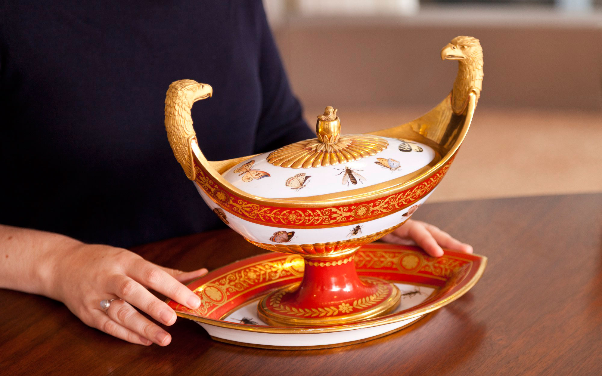A sugar bowl from the ‘Marly Rouge’ dessert service, with handles in the form of gilded eagle heads