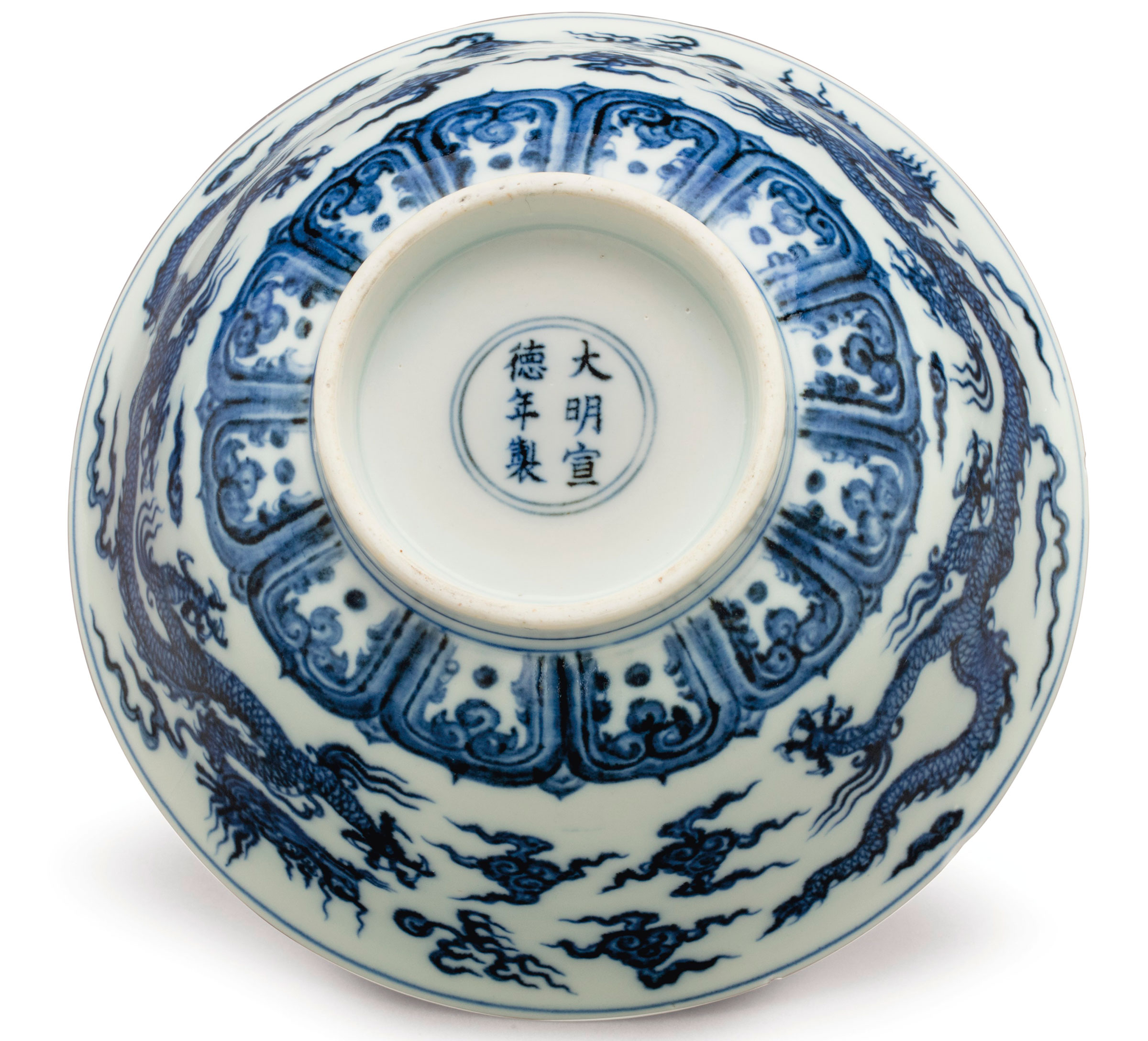 The six-character mark in underglaze blue within a double circle and of the period (1426-1435)