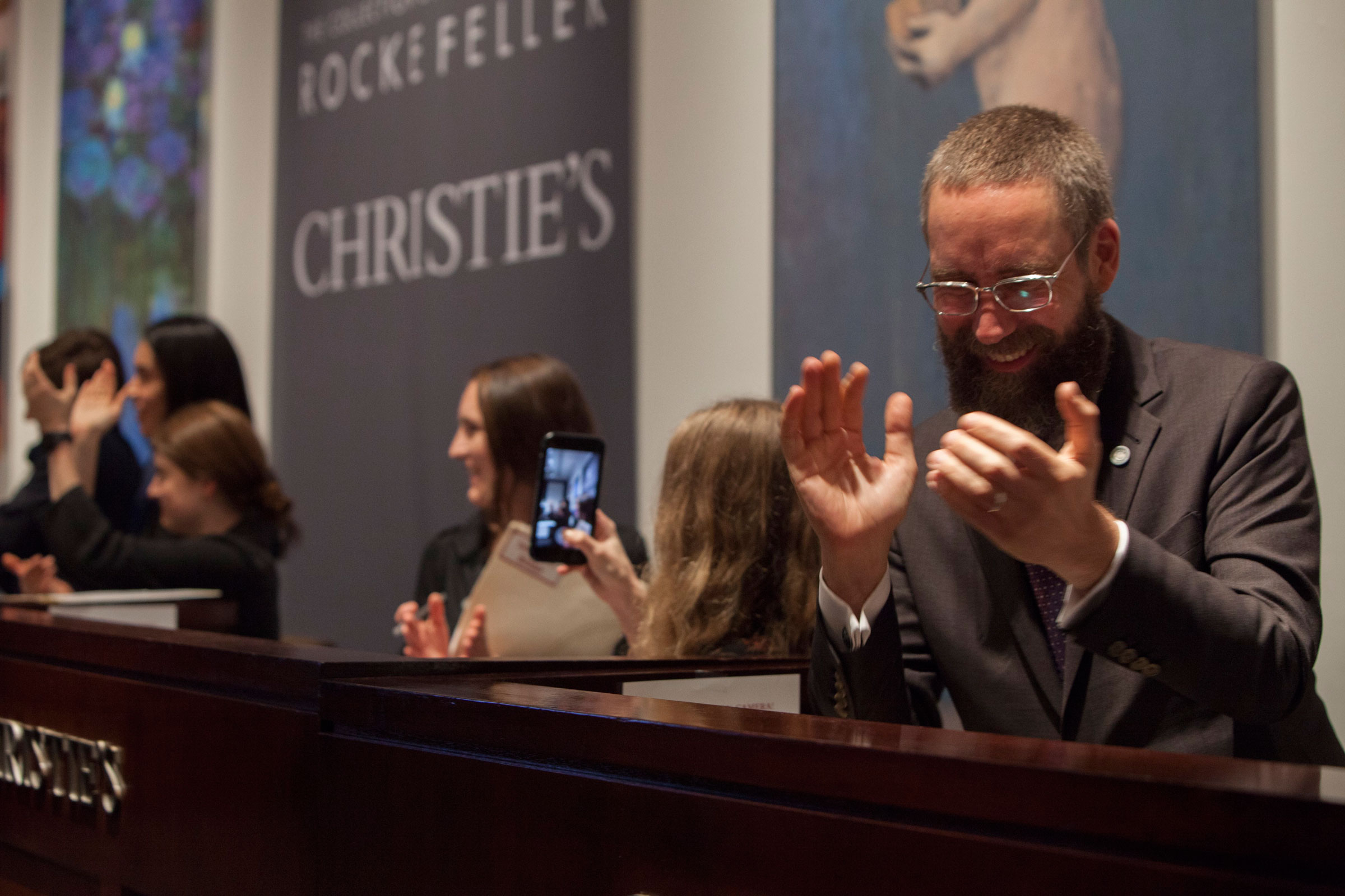 Applause as the last lot is sold in the final live auction, which finished at 2am on Friday morning