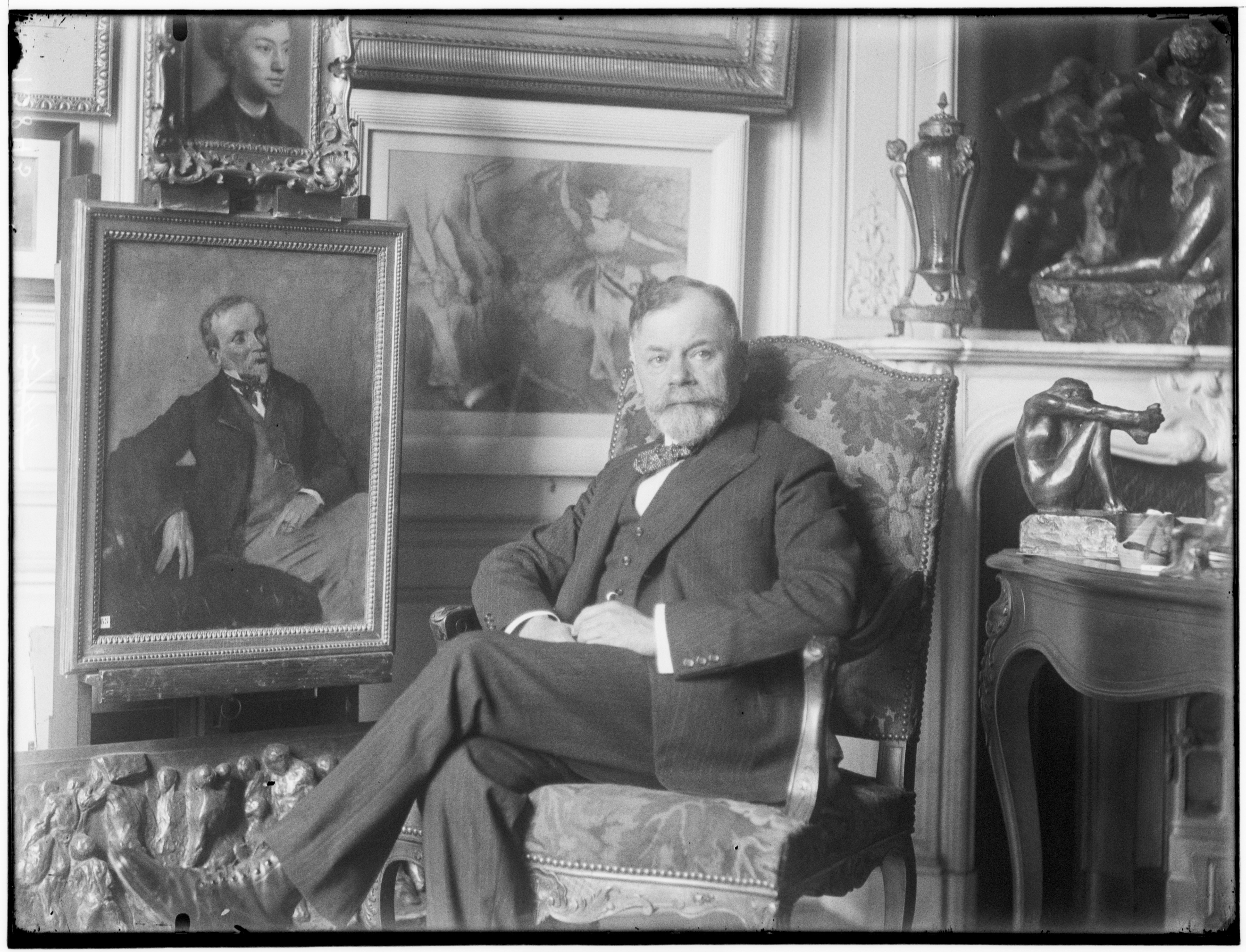 Georges Viar, collector and friend of Sisley, Monet, Renoir, Degas, Picasso and Vuillard, beneath a Degas painting in a white frame. Photo by Francois Antoine Vizzavona. Photo © RMN-Grand Palais / Frank Raux 