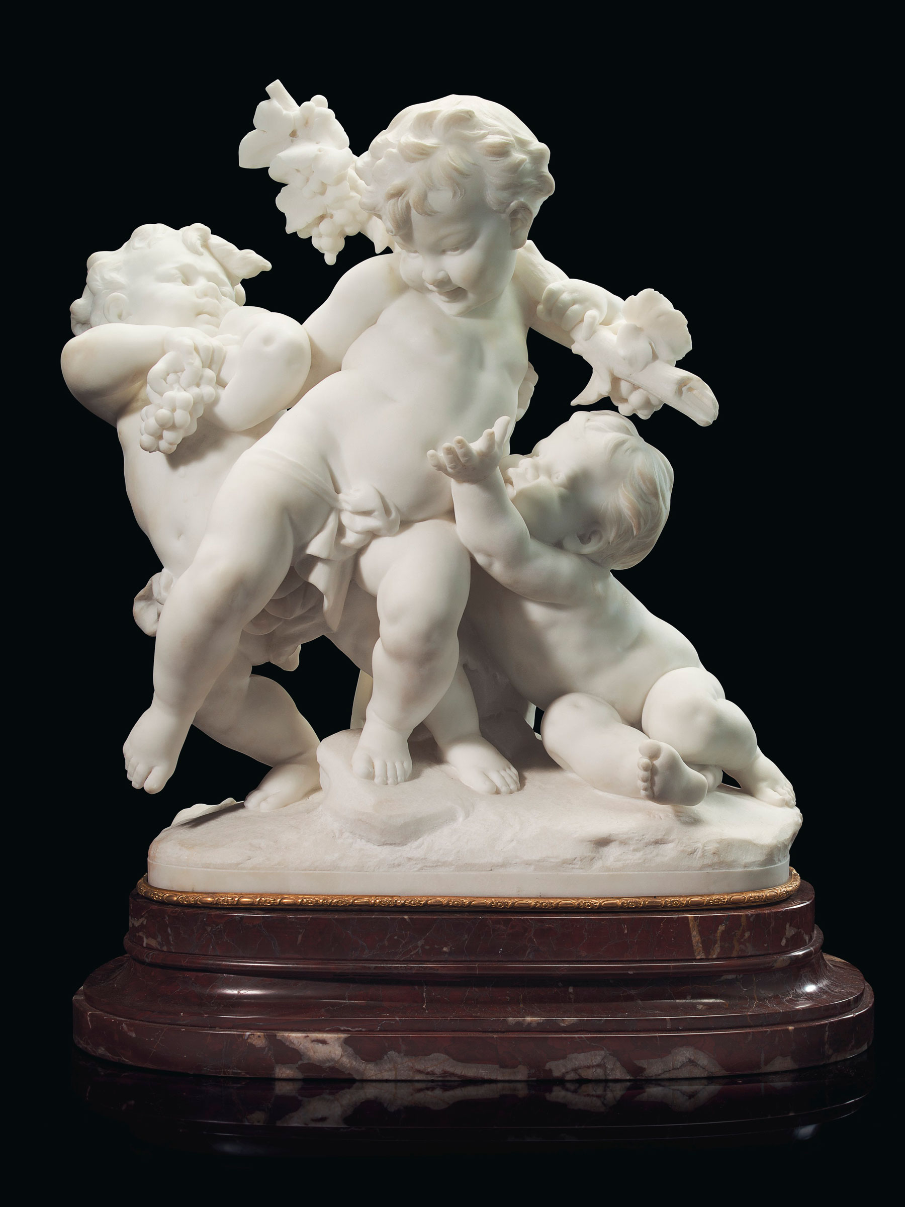 This pair of drunken putti by Benoît Rougelet (1834-1894), who first showed at the Salon of 1868, is carved from imported Italian Carrara marble