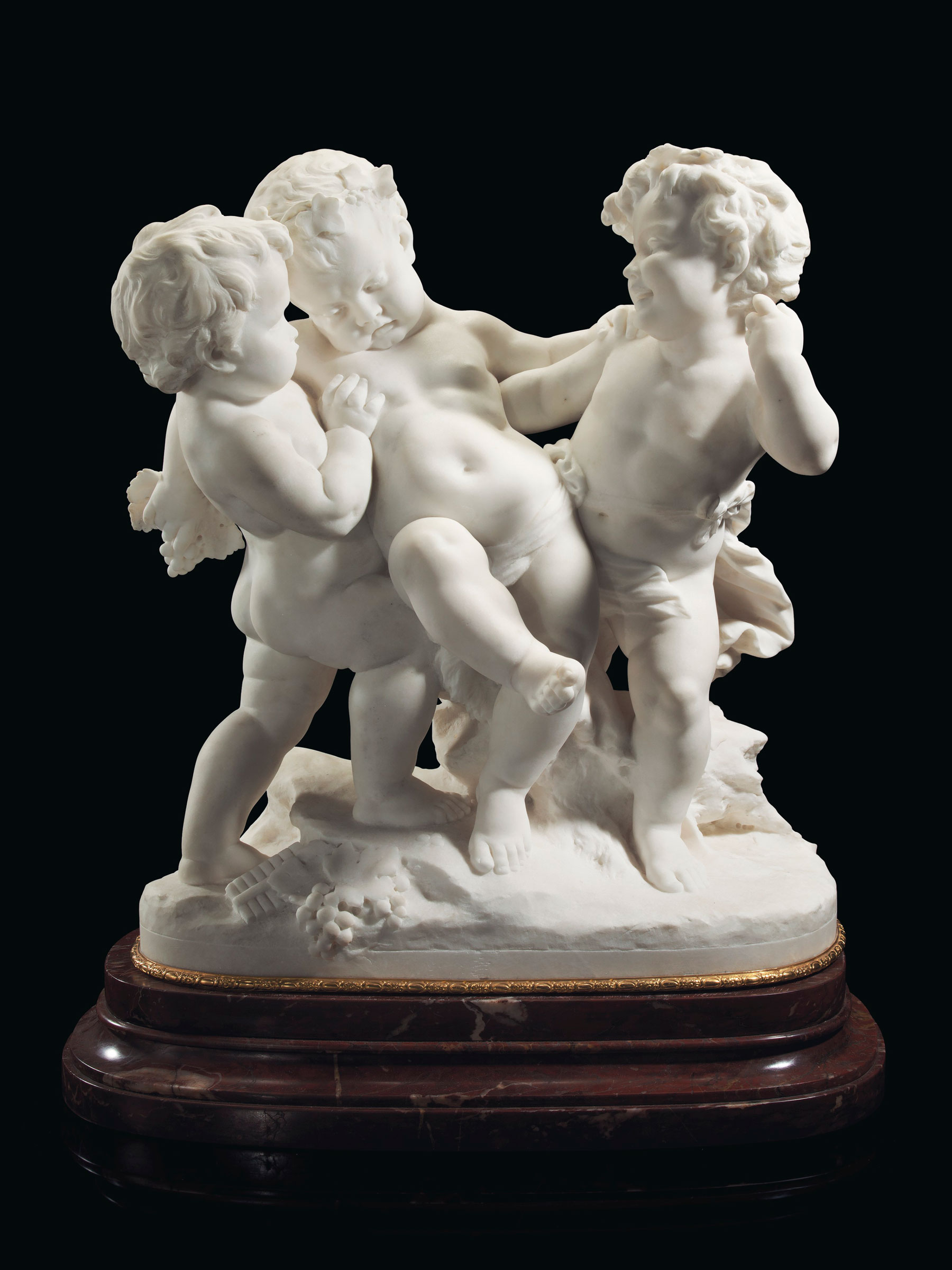 Benoît (known as Bénédict) Rougelet (French, 1834–1894), Le bacchanal, circa 1880-1890. Marble on an ormolu-mounted rouge marble plinth. La bacchanal: 28 1/2 in (72.4 cm) high, 24 in (61 cm) wide. Estimate: $40,000–60,000. Offered in A Golden Age: An Important Collection of 19th Century Furniture & Decorative Art, 16 October at Christie's in New York